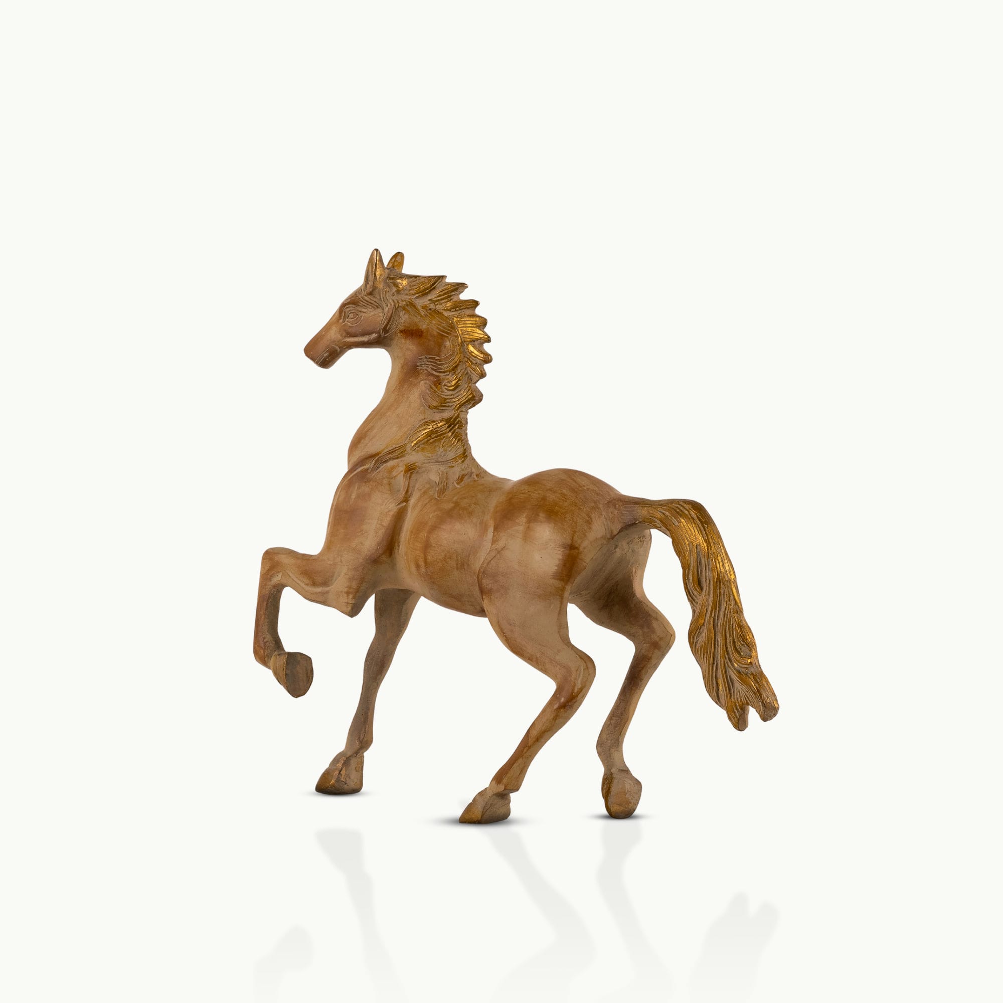 Antique resin-cast stylized horse figurine with gilded mane and tail