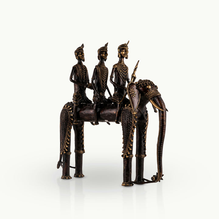 Dhokra Brass Processional Elephant Sculpture carrying three riders for a rustic wooden console