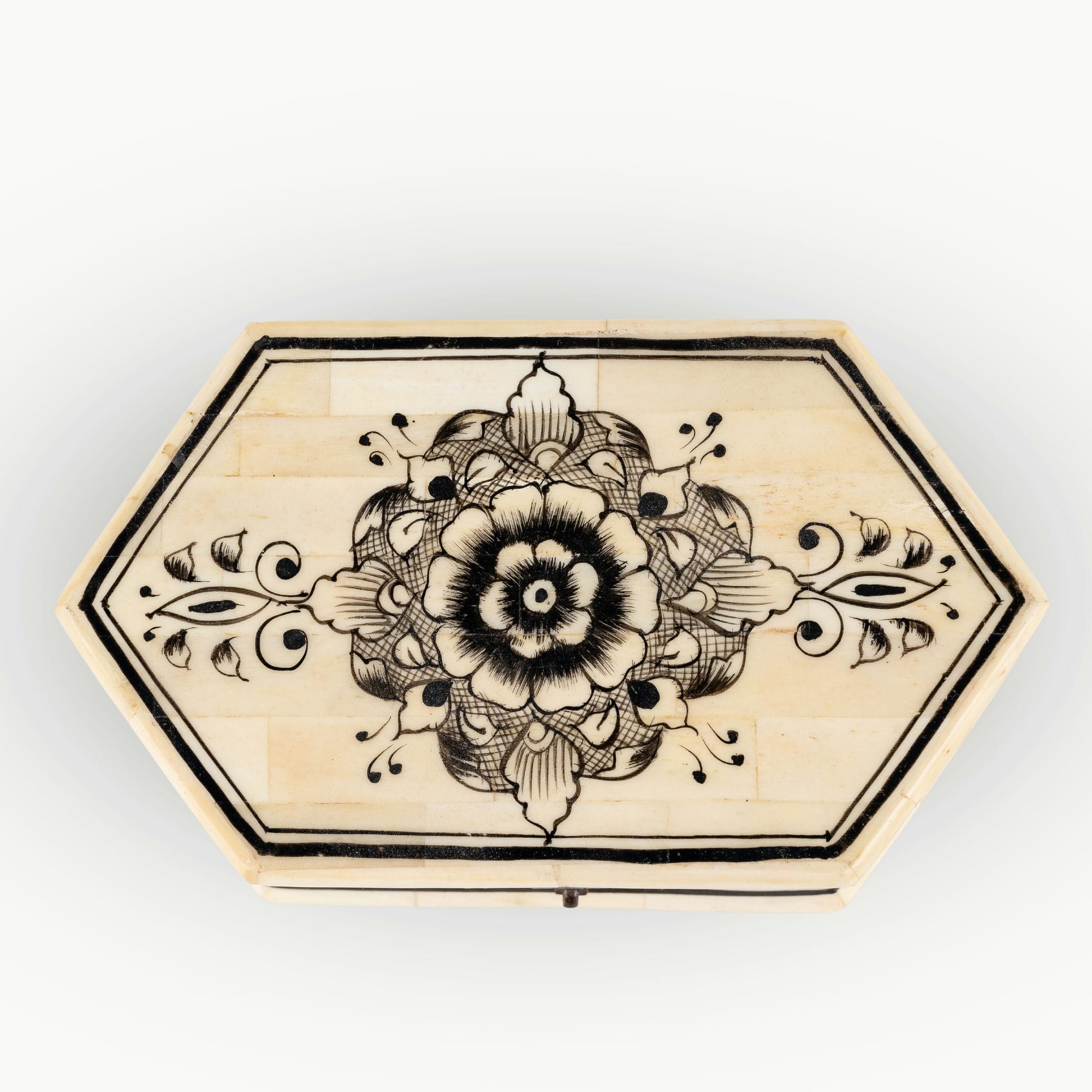 Octagonal painted camel bone box featuring black ink mandala motifs.