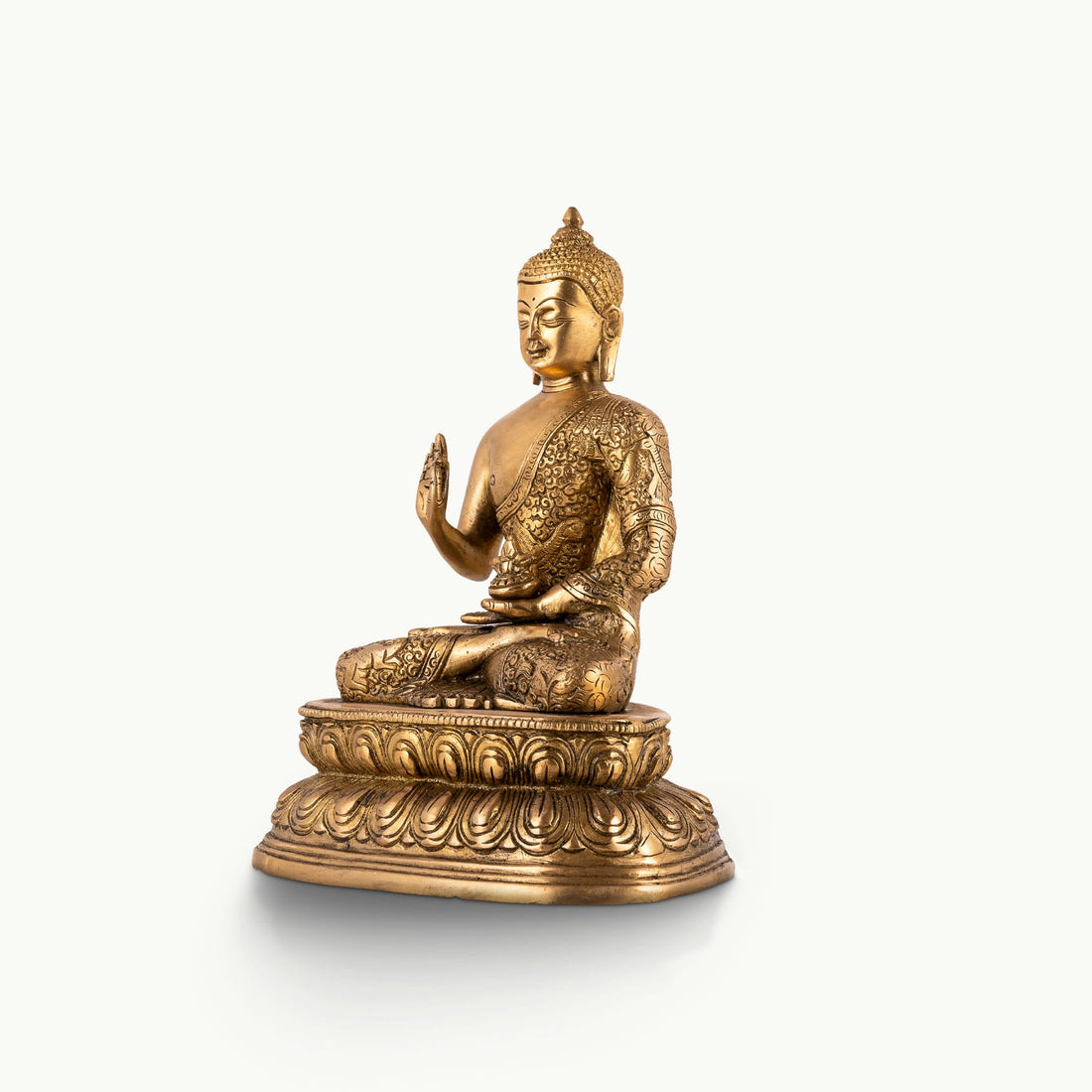 Antique polished brass buddha in abhaya mudra on tiered lotus base