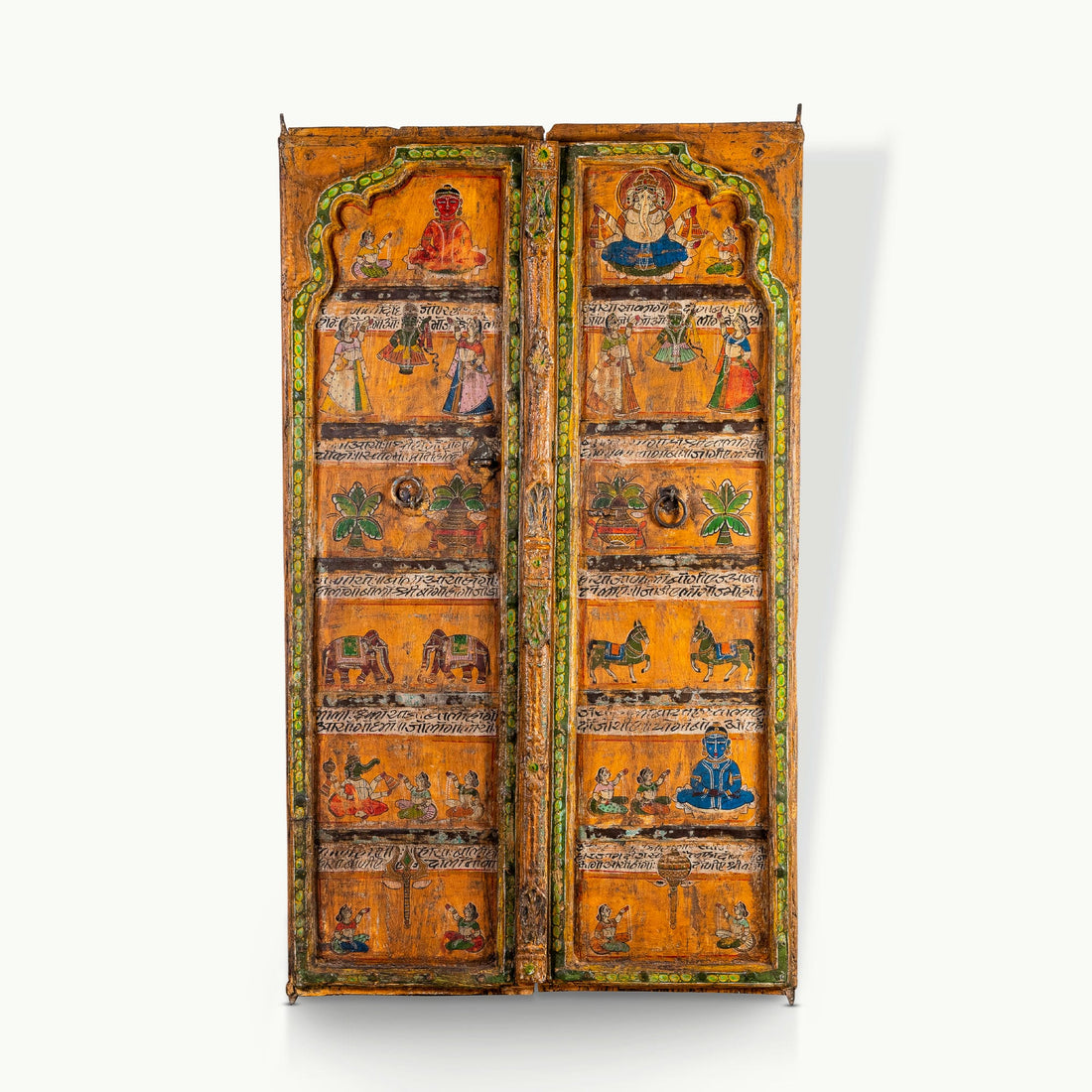Painted mango wood doors featuring traditional deity murals and distressed iron hardware.