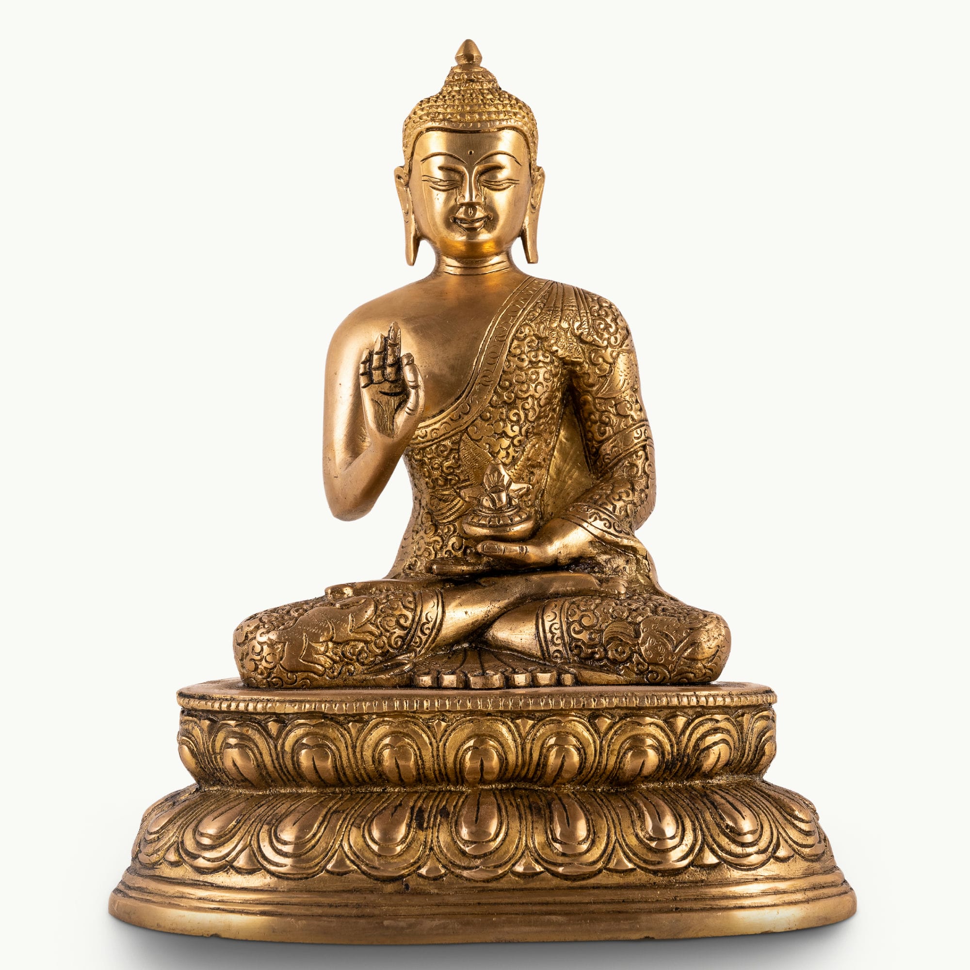 Antique polished brass buddha in abhaya mudra on tiered lotus base