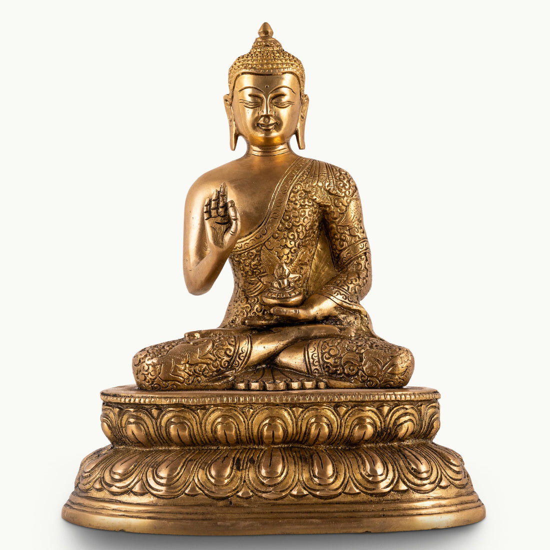 Antique polished brass buddha in abhaya mudra on tiered lotus base