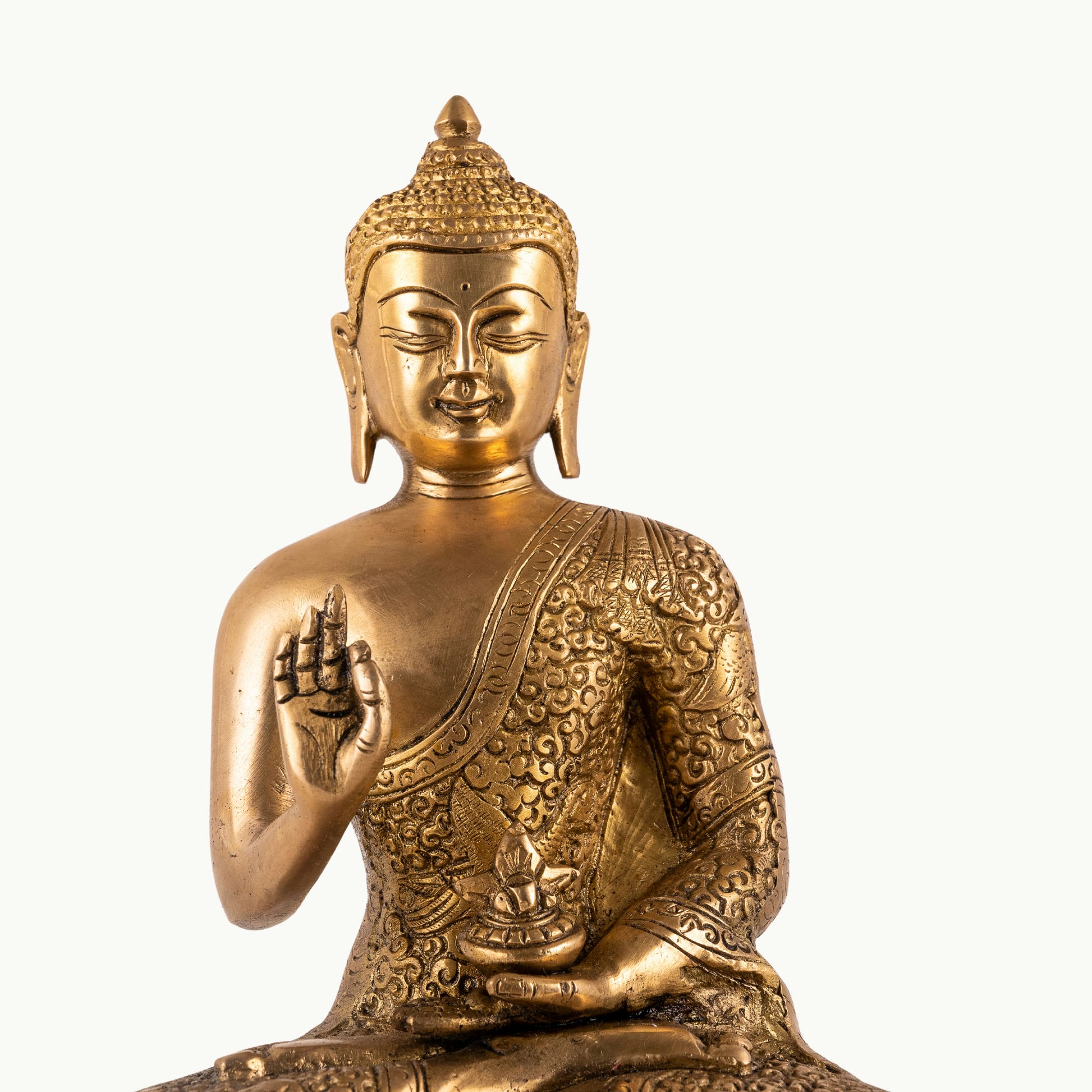 Antique polished brass buddha in abhaya mudra on tiered lotus base