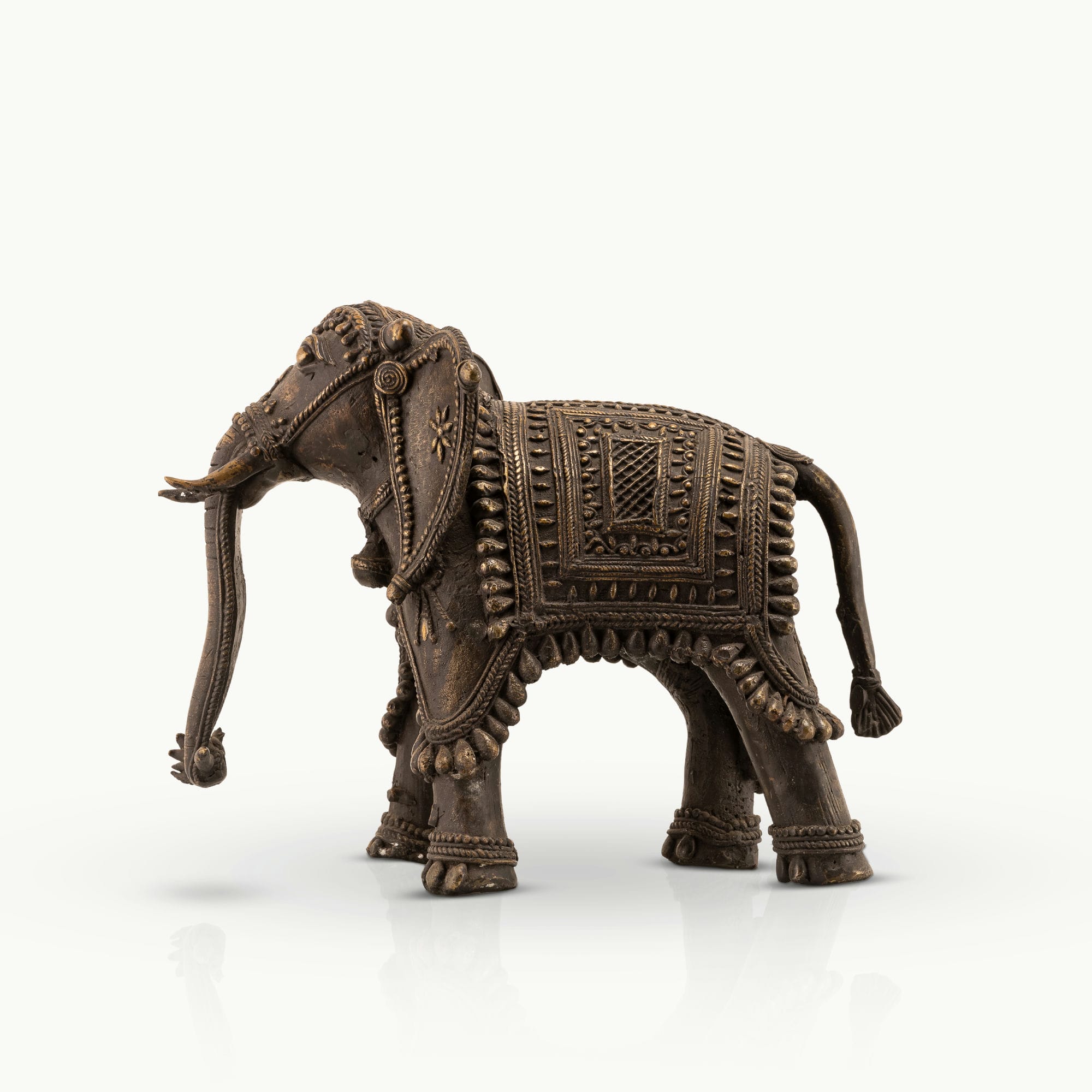 Indian ceremonial guardian decor showcasing intricate beadwork and dark patina for a solid mahogany desk or heritage office decor.