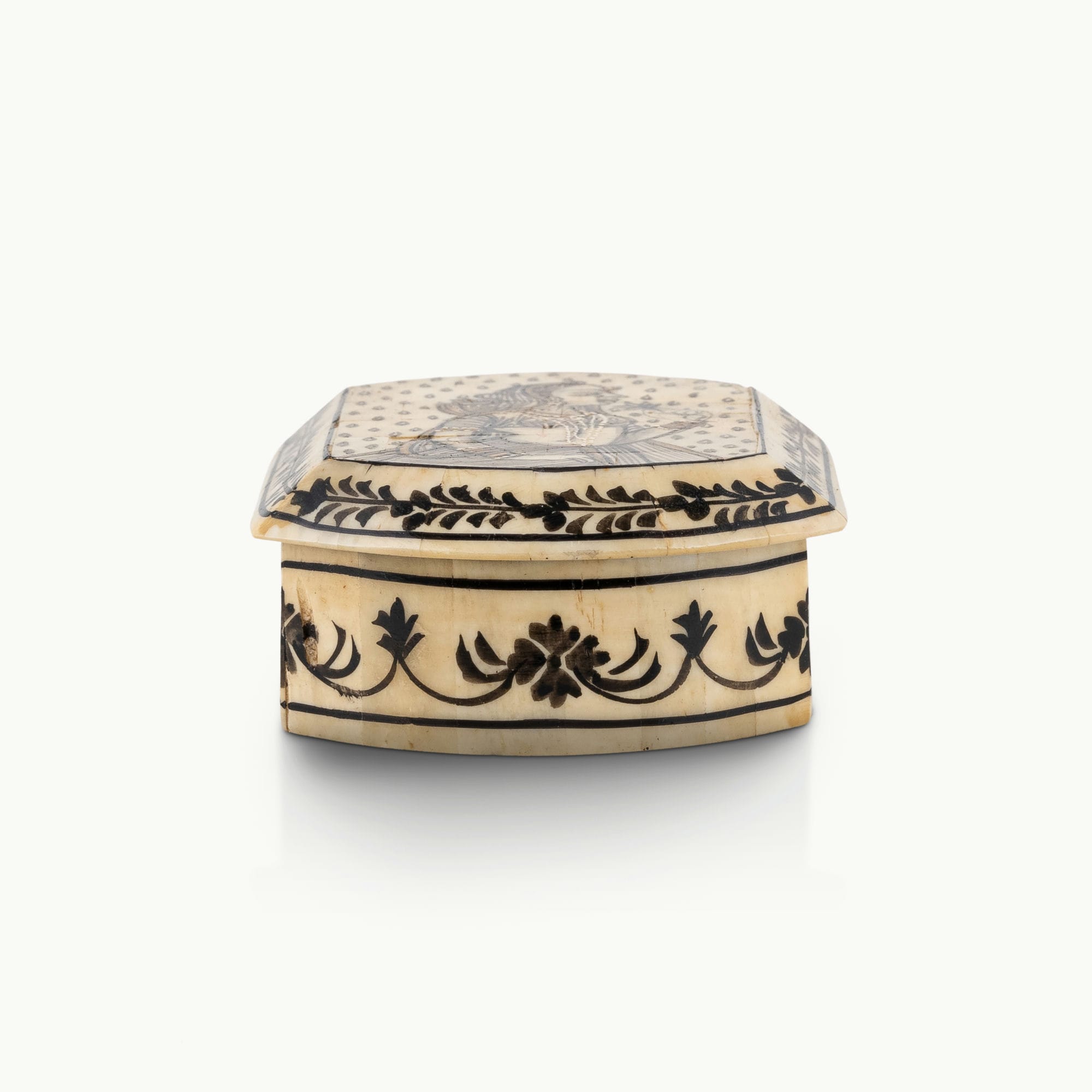 Portrait painted camel bone box featuring a Rajput noblewoman and black floral borders.