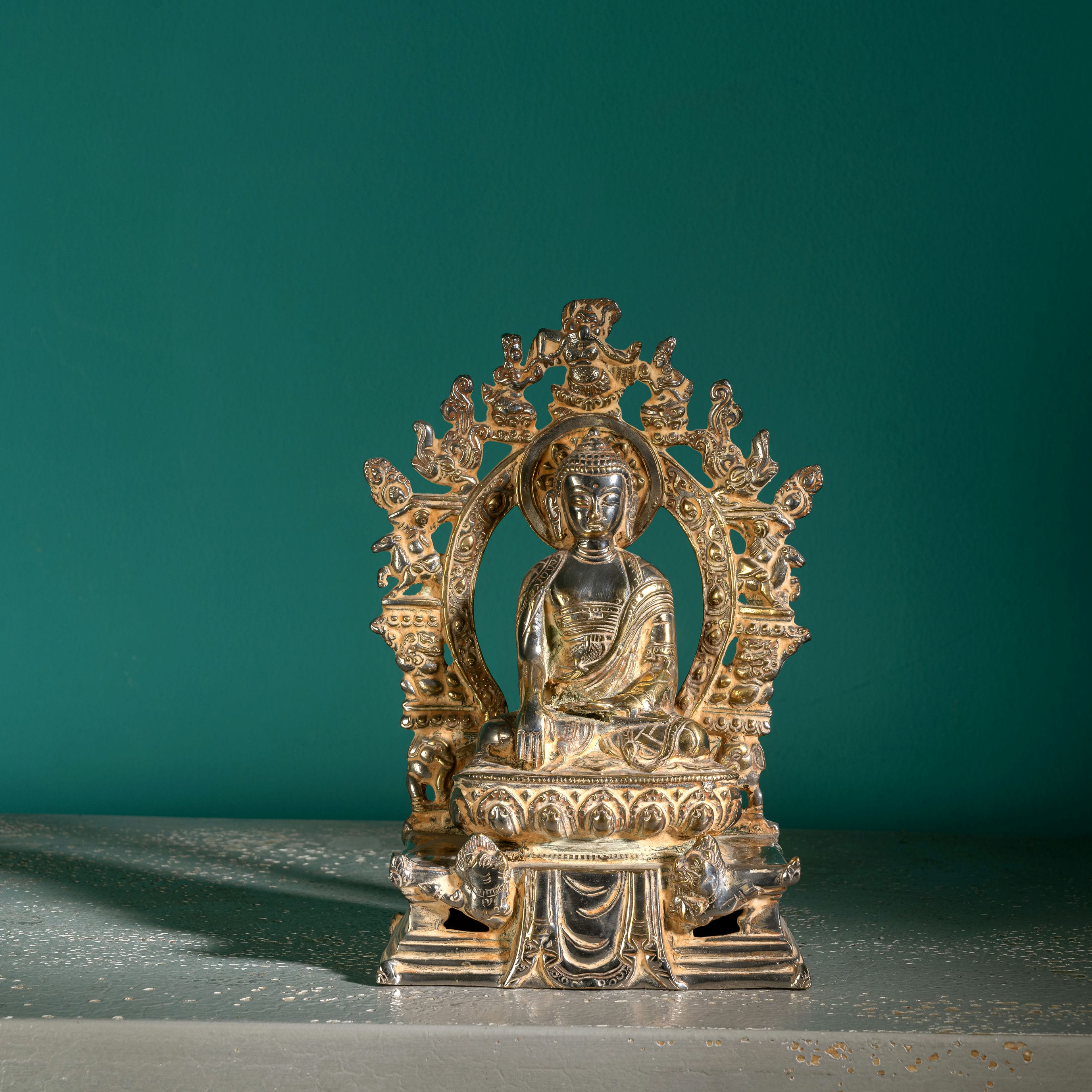 Handcrafted metal enlightened ascetic idol with an antiqued aureole for a meditation room centerpiece or spiritual housewarming gift.