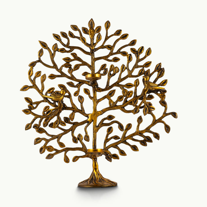 Brass tree of life sculpture with intricate branches and nesting birds.