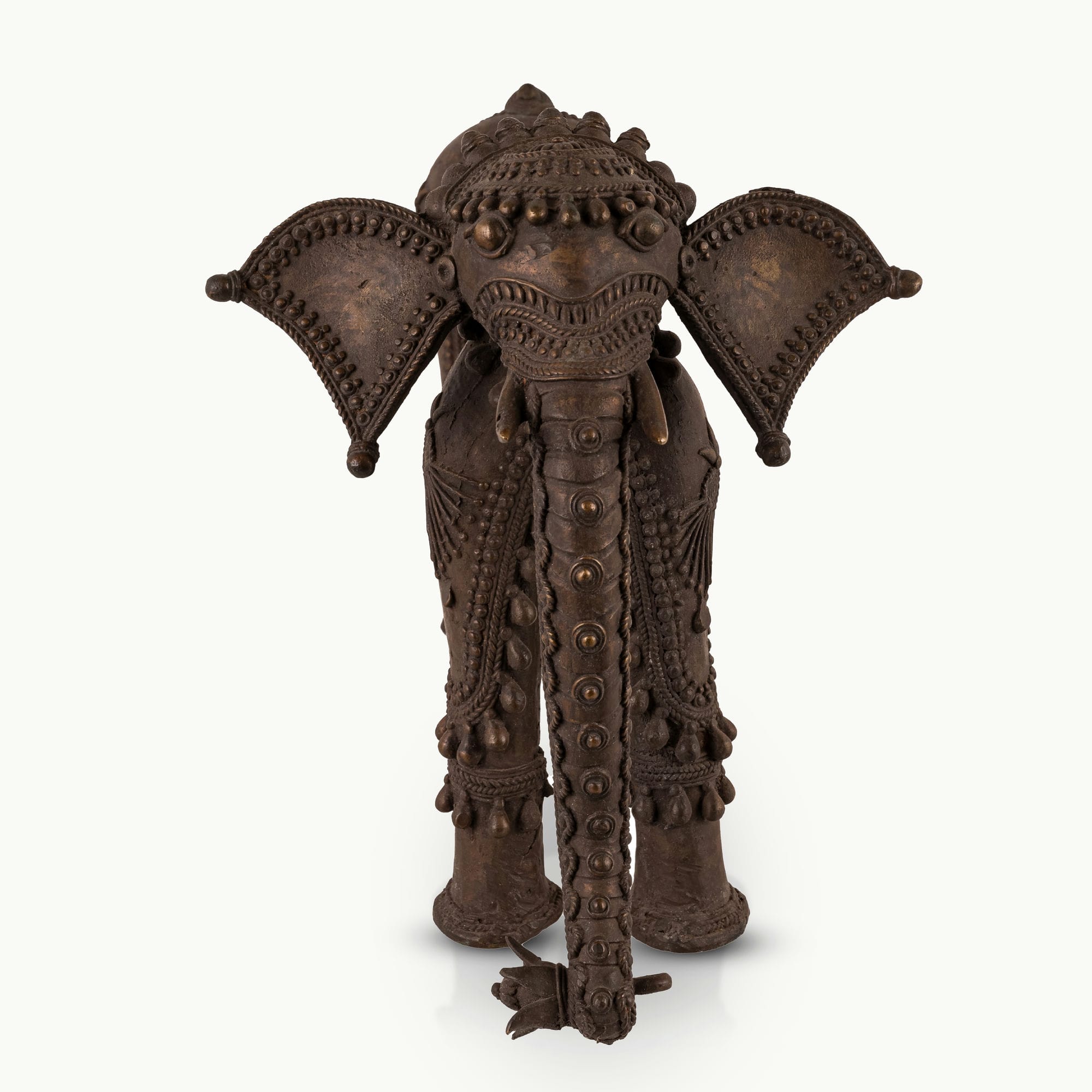Dhokra Brass Tribal Elephant Statue featuring sunburst medallions for a concrete console. 