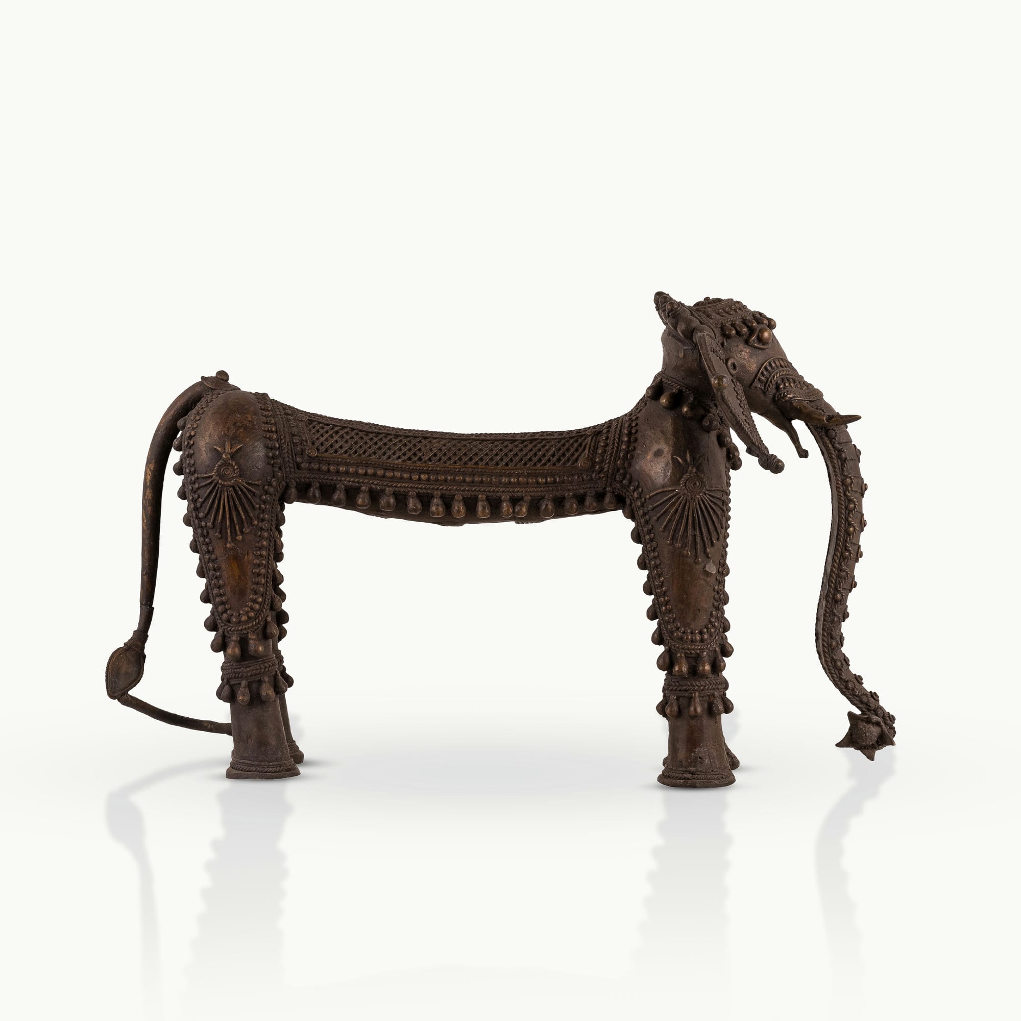 Dhokra Brass Tribal Elephant Statue featuring sunburst medallions for a concrete console. 