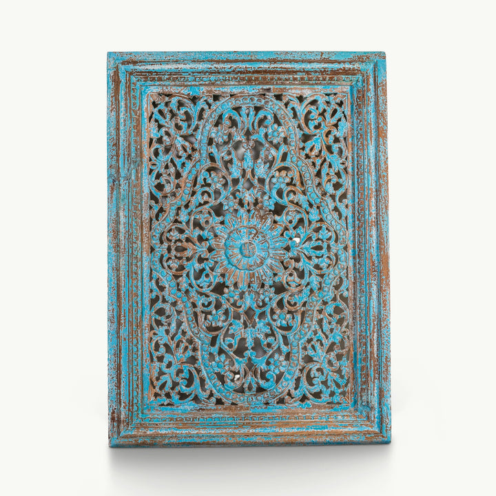 Blue pierced mango wood panel crafted from solid timber with intricate floral carving.
