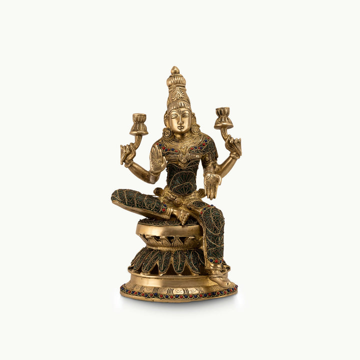 Stone Inlay Brass Lakshmi Statue granting boons on an east-facing altar. 