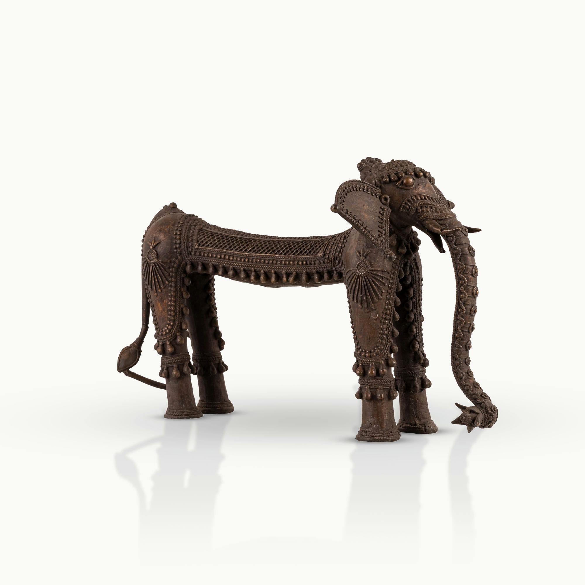 Dhokra Brass Tribal Elephant Statue featuring sunburst medallions for a concrete console. 