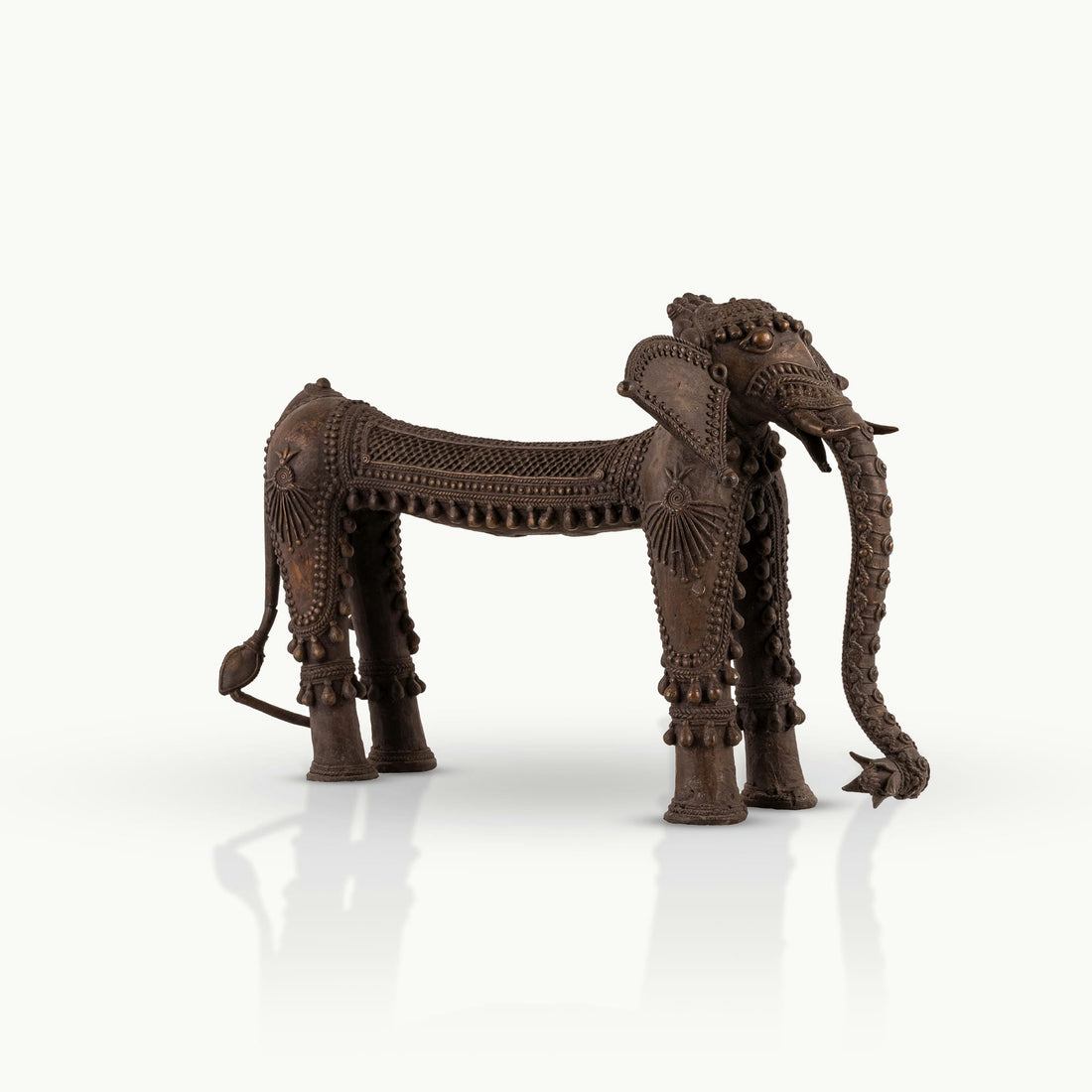 Dhokra Brass Tribal Elephant Statue featuring sunburst medallions for a concrete console. 