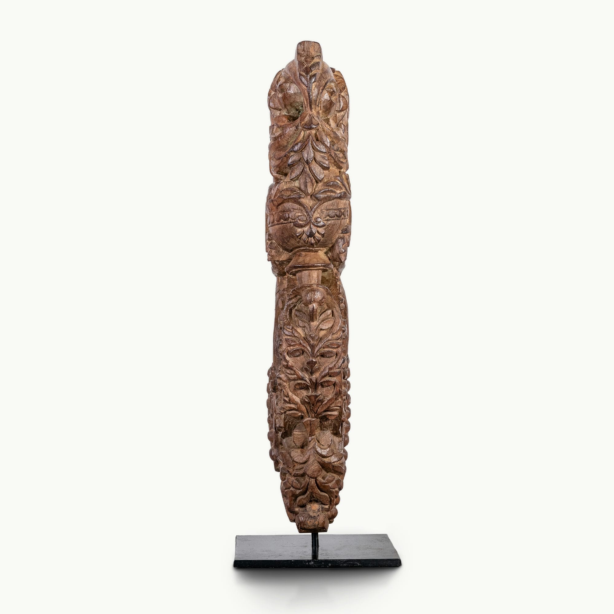 Carved wooden haveli bracket featuring a mythological avian sentinel.