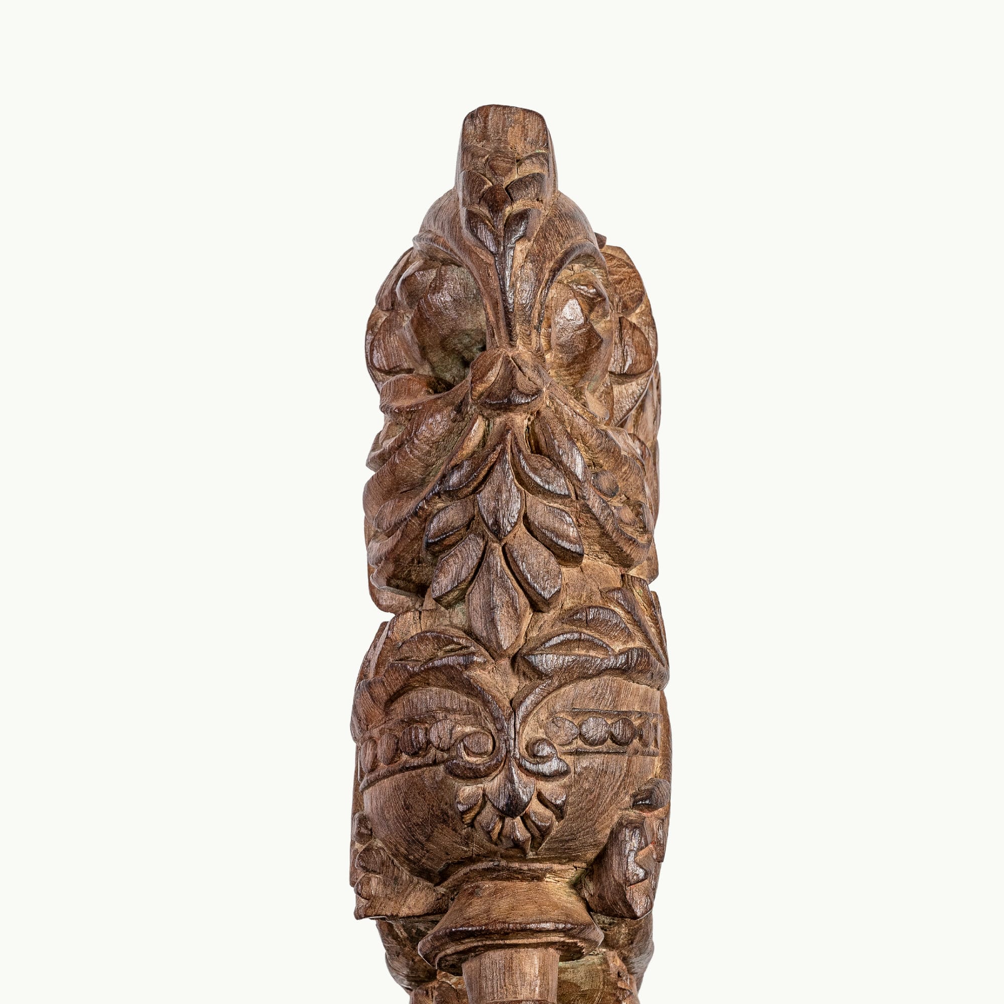 Carved wooden haveli bracket featuring a mythological avian sentinel.