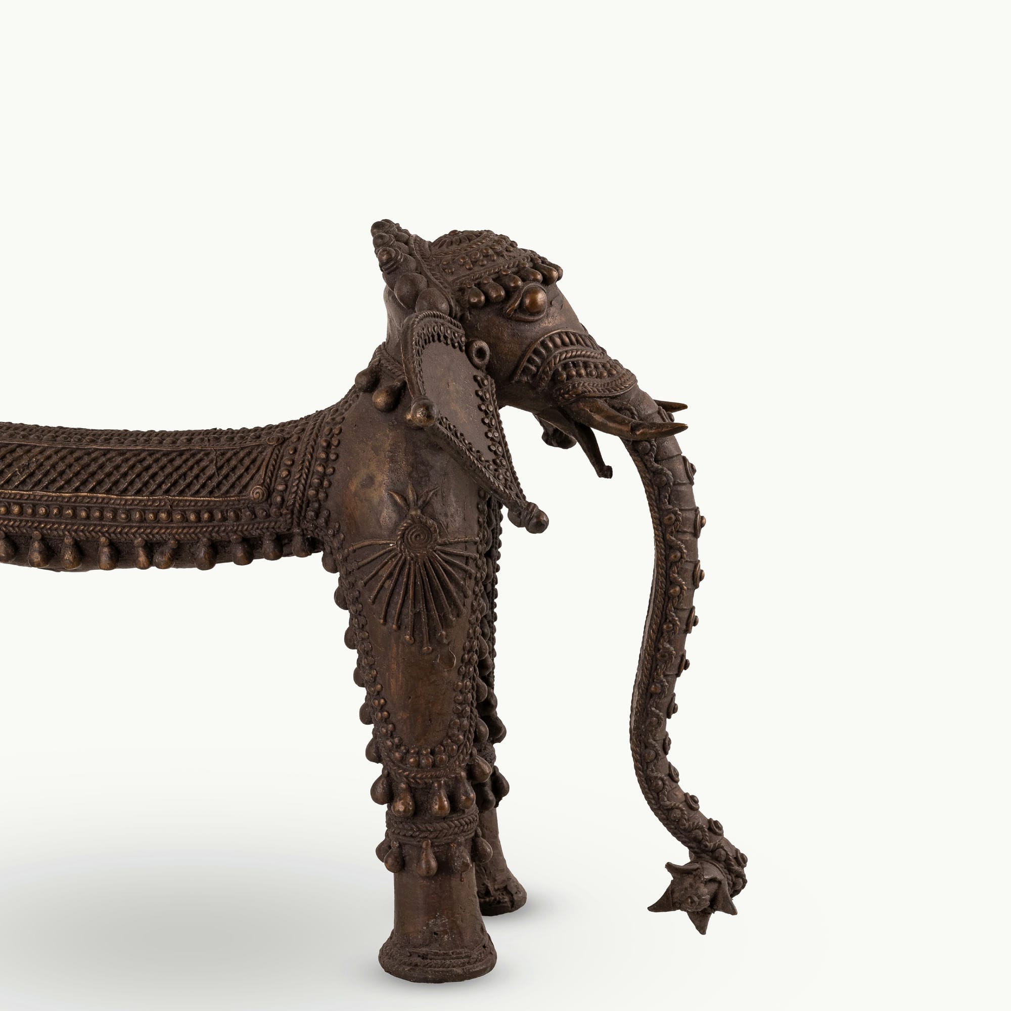 Dhokra Brass Tribal Elephant Statue featuring sunburst medallions for a concrete console. 