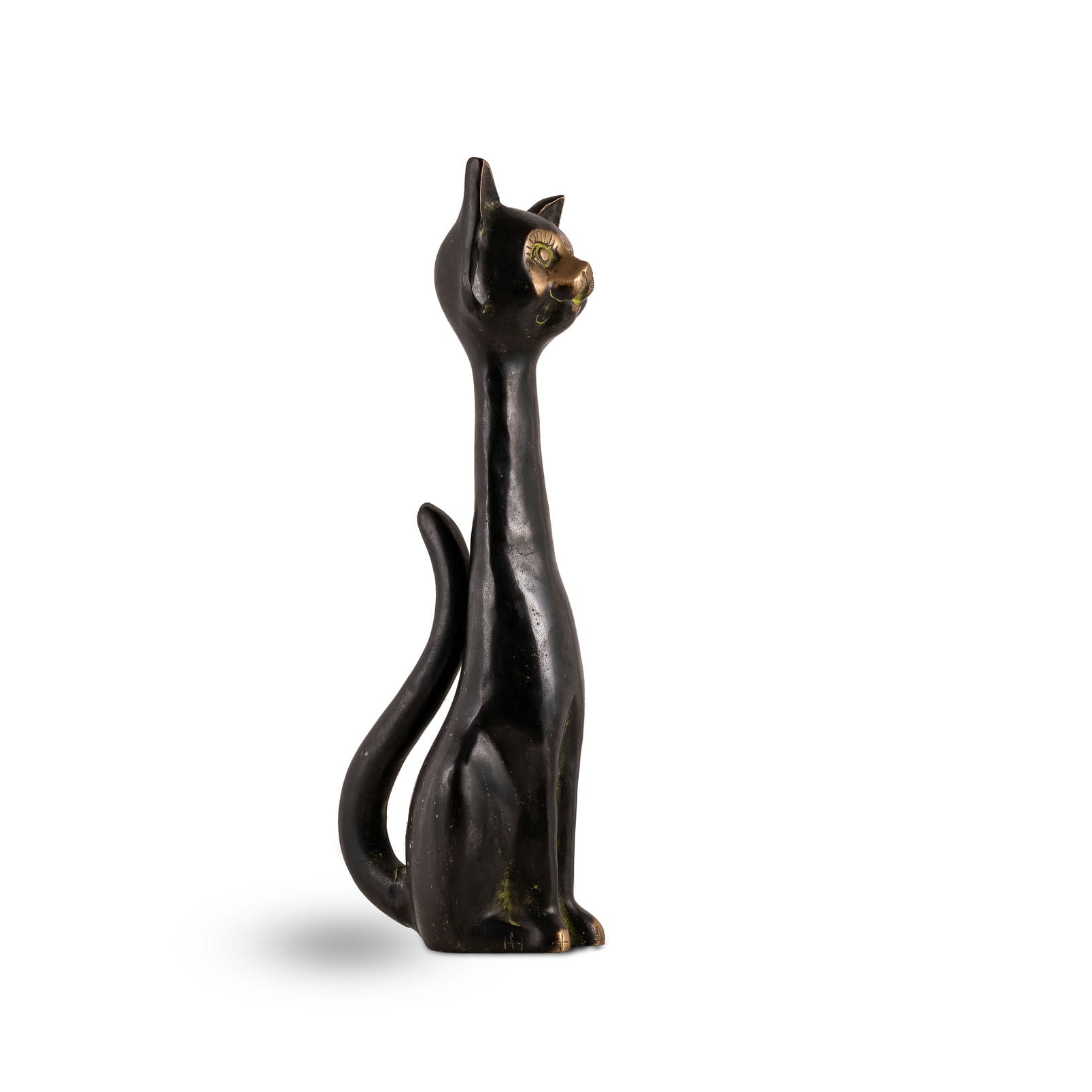 Elongated Black Brass Cat Sculpture in upright observation on an open display shelf. 