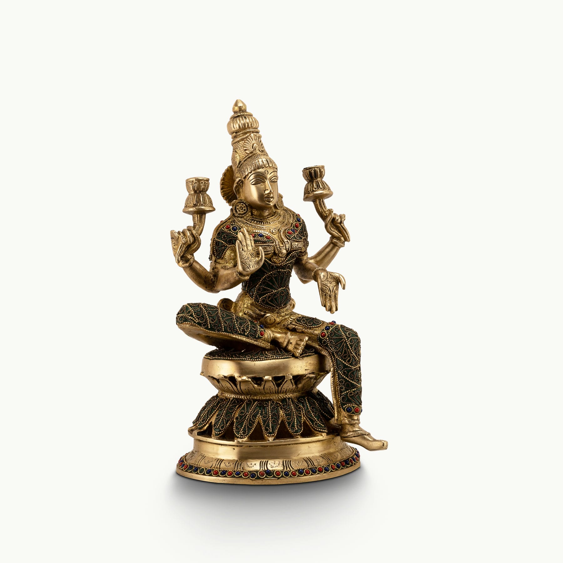 Stone Inlay Brass Lakshmi Statue granting boons on an east-facing altar. 