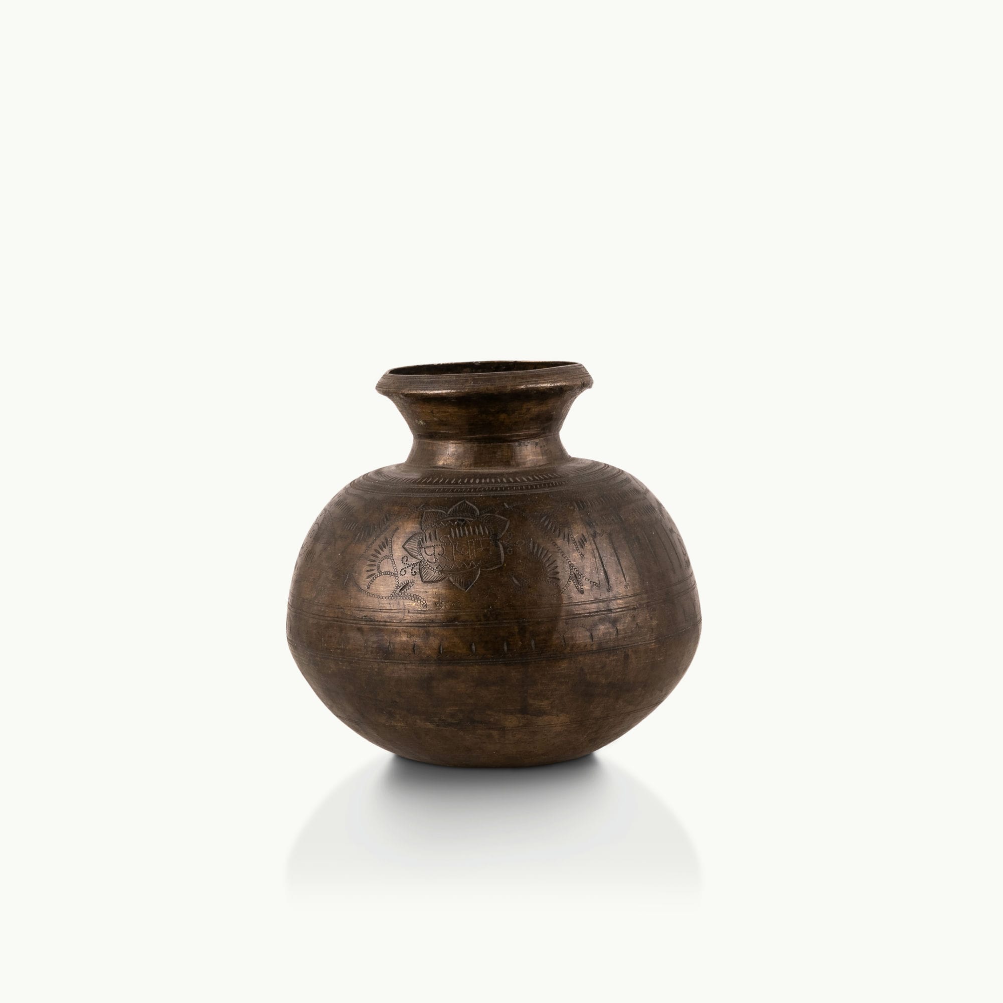 Engraved Antique Brass Water Pot chased for a rustic wooden console.