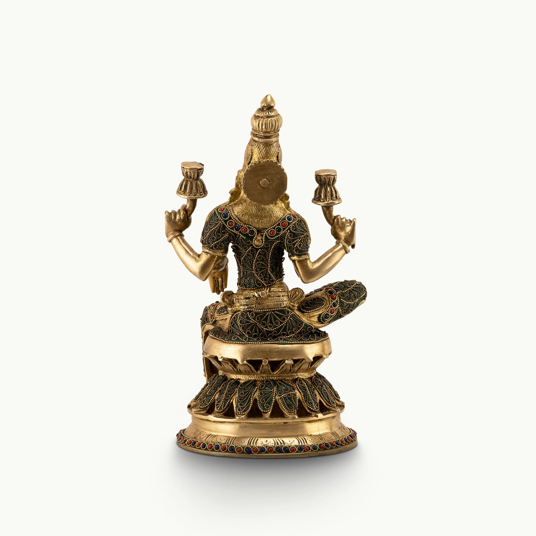Stone Inlay Brass Lakshmi Statue granting boons on an east-facing altar. 
