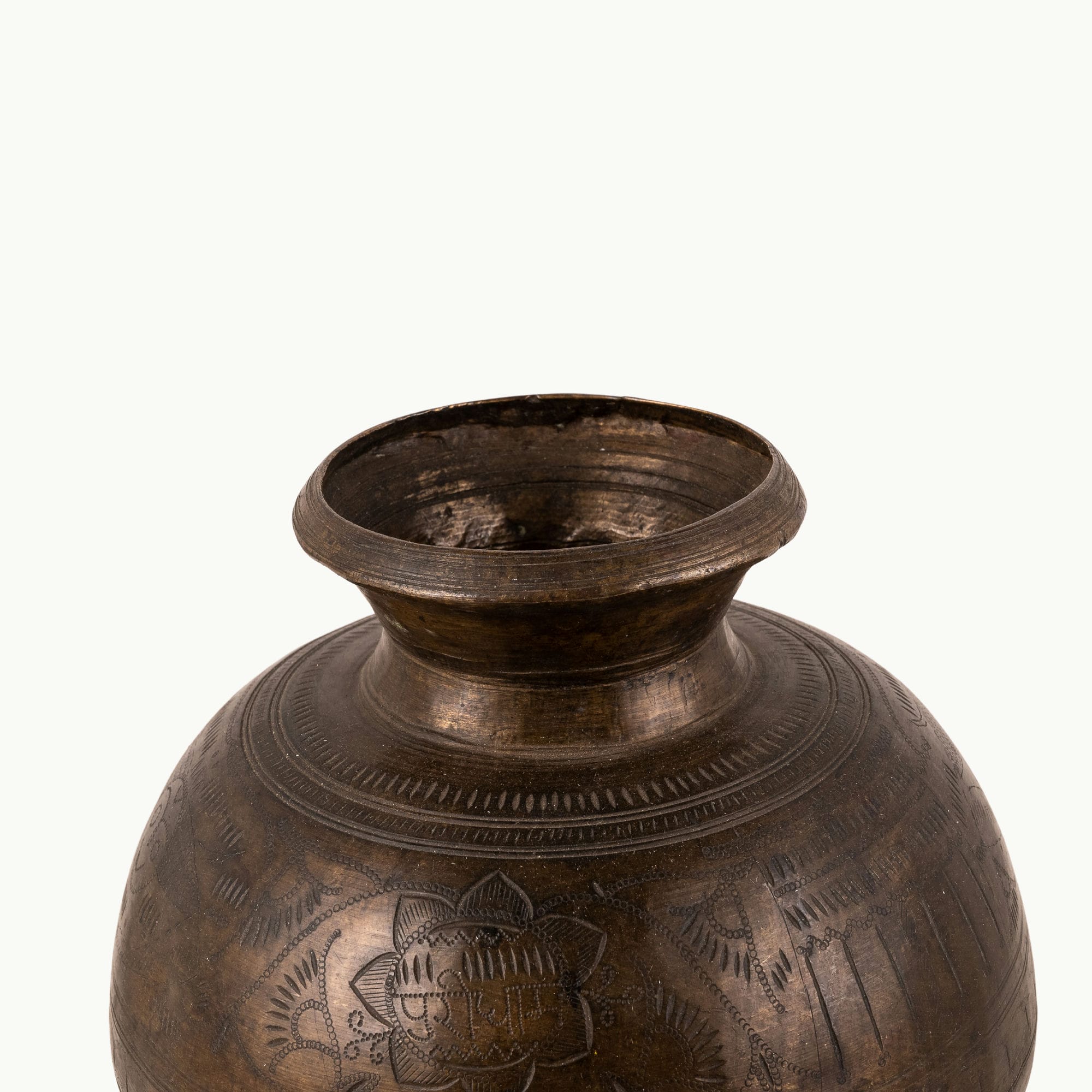 Engraved Antique Brass Water Pot chased for a rustic wooden console.