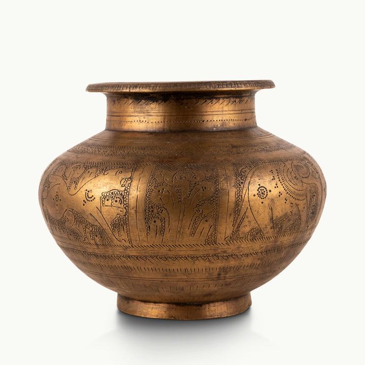 Engraved Brass Elephant Water Pot wrapped in a wildlife frieze for a walnut executive desk.