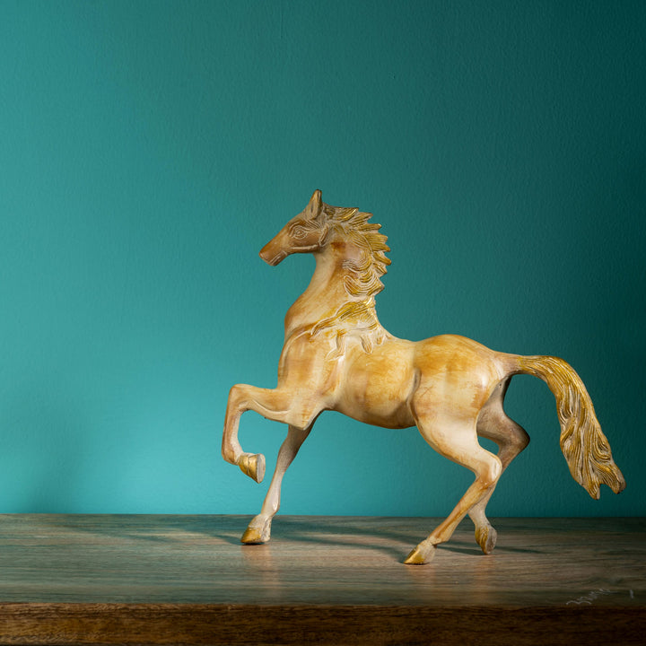 Antique resin-cast stylized horse figurine with gilded mane and tail