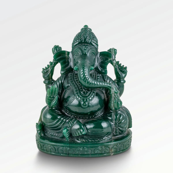 Jade stone Ganesha statue seated in Abhaya mudra with a highly polished emerald finish.