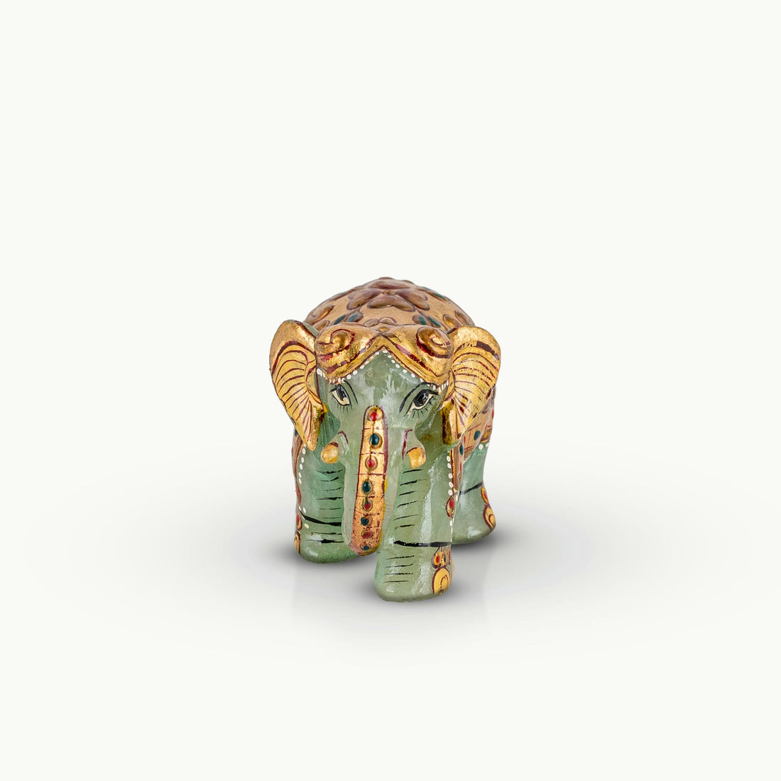 Hand-painted green marble elephant with gold ceremonial details.