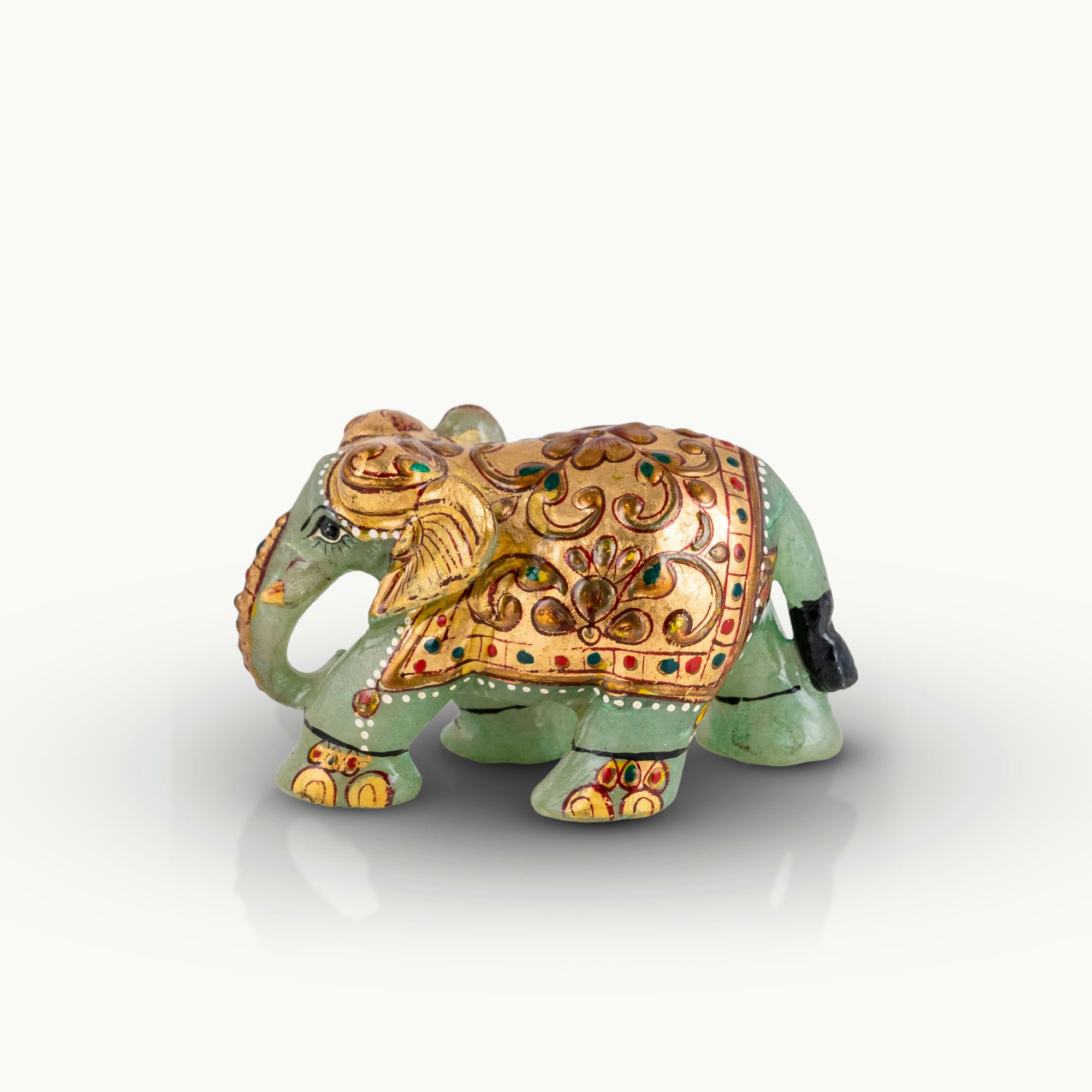 Hand-painted green marble elephant with gold ceremonial details.