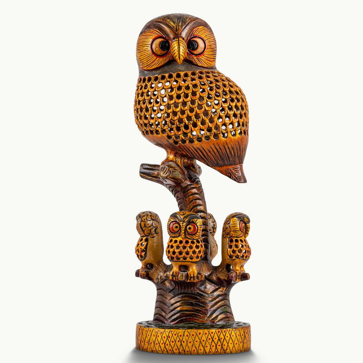 Pierced rosewood owl sculpture with three miniature owlets and an intricate honeycomb wooden lattice.