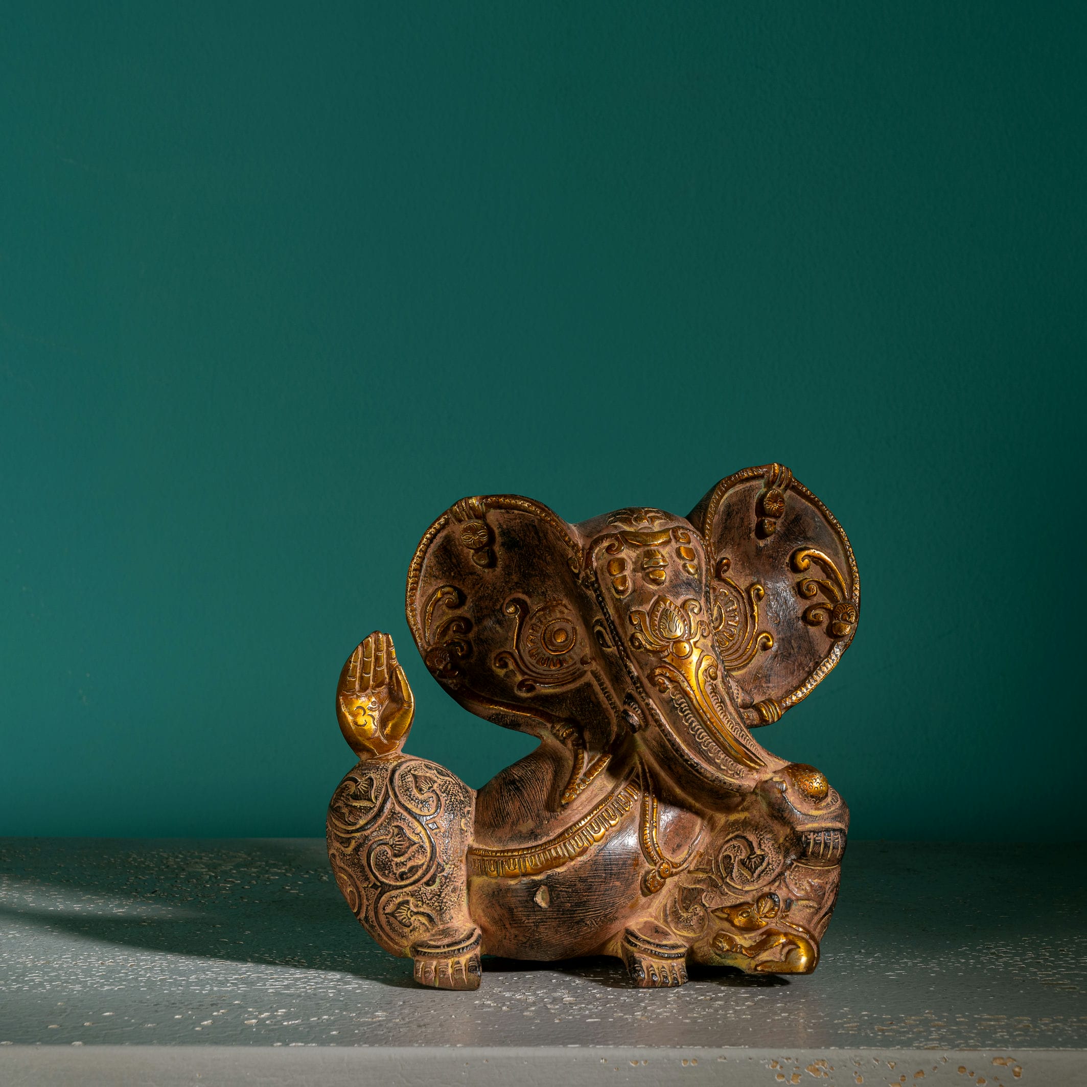 Premium metal Ganpati idol displaying the protective Abhaya mudra for an entryway console or 