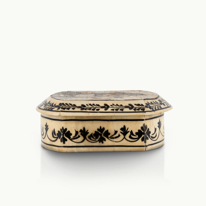 Portrait painted camel bone box featuring a Rajput noblewoman and black floral borders.