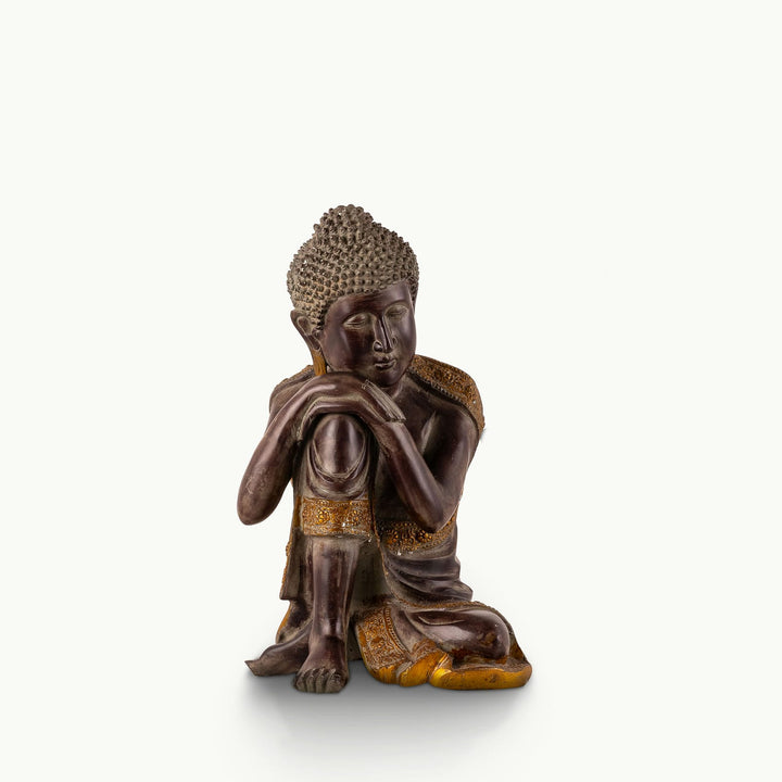 Dark Brass Resting Buddha Statue with a head on its knee for a low minimalist console.