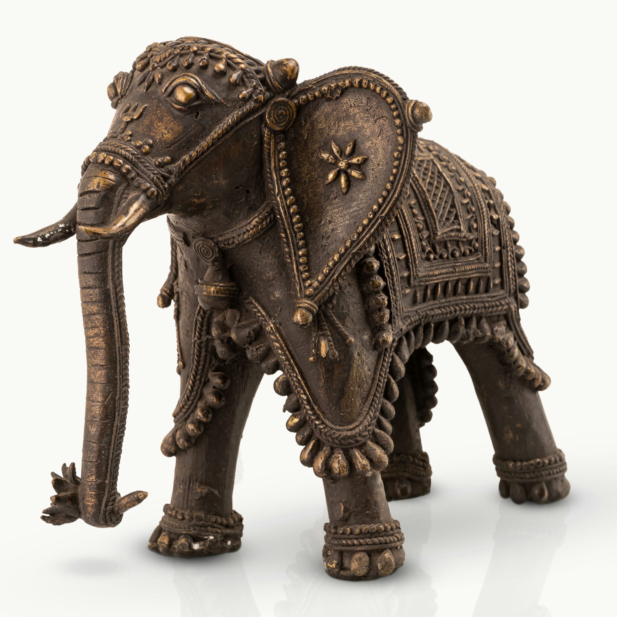 Indian ceremonial guardian decor showcasing intricate beadwork and dark patina for a solid mahogany desk or heritage office decor.