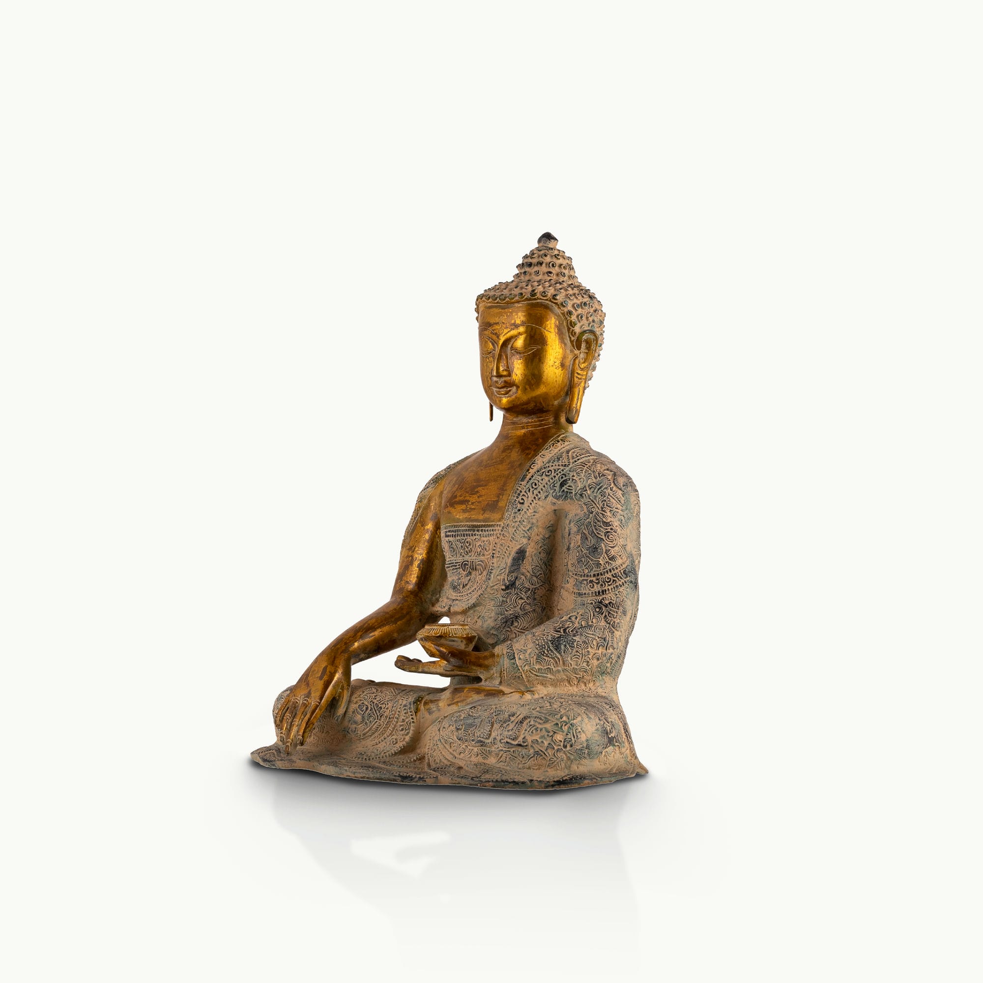 Patterned Brass Bhumisparsha Buddha Statue touching the earth for a sunlit atrium. 
