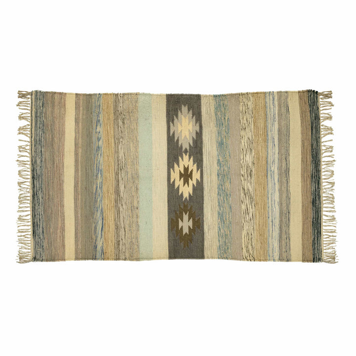 Handwoven cotton wool dhurrie in a bedroom, displaying charcoal starbursts and earthy horizontal stripes. 