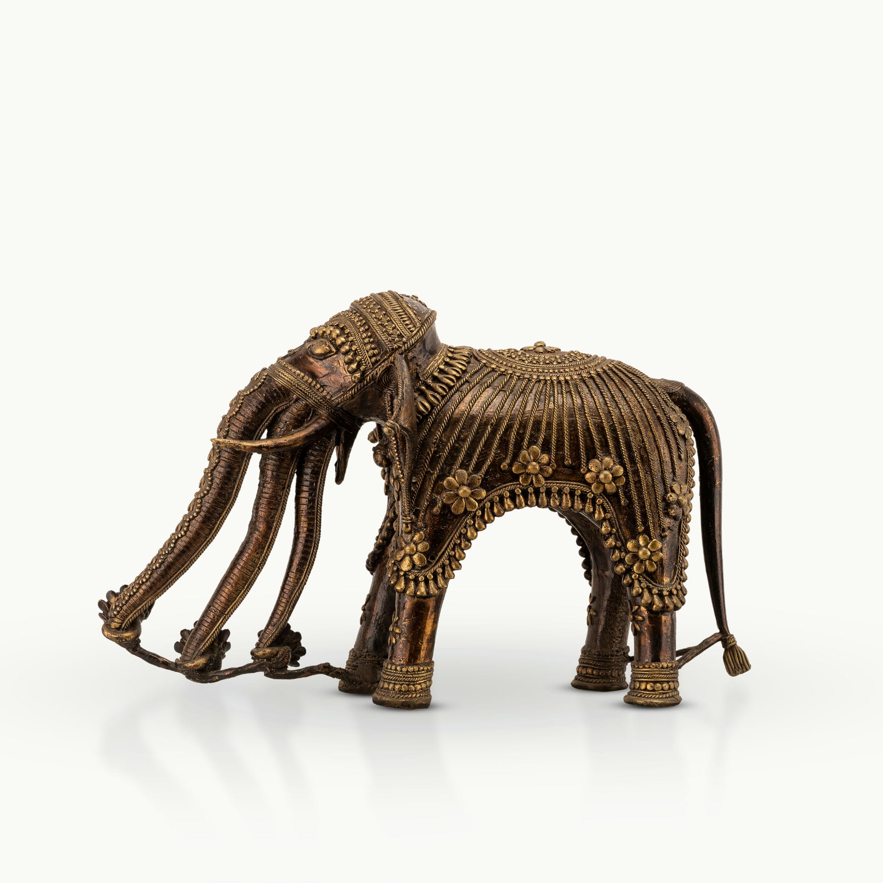 Monumental Brass Elephant Sculpture showing grounded authority on a reinforced architectural console. 