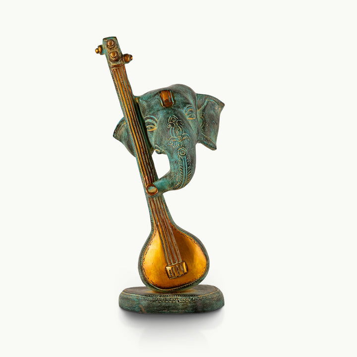 Verdigris Musical Elephant Sculpture on a classical stringed instrument for a console.