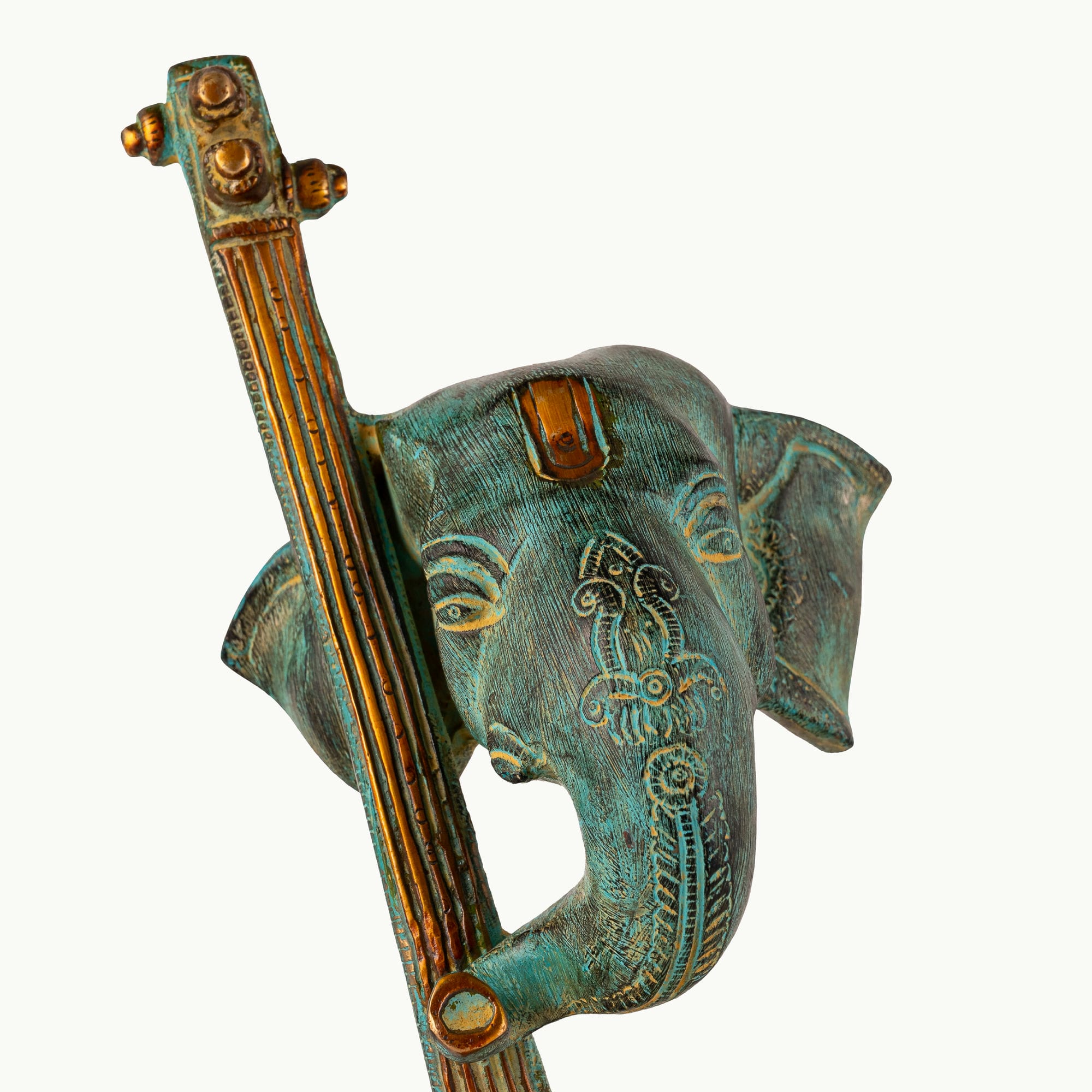 Verdigris Musical Elephant Sculpture on a classical stringed instrument for a console.