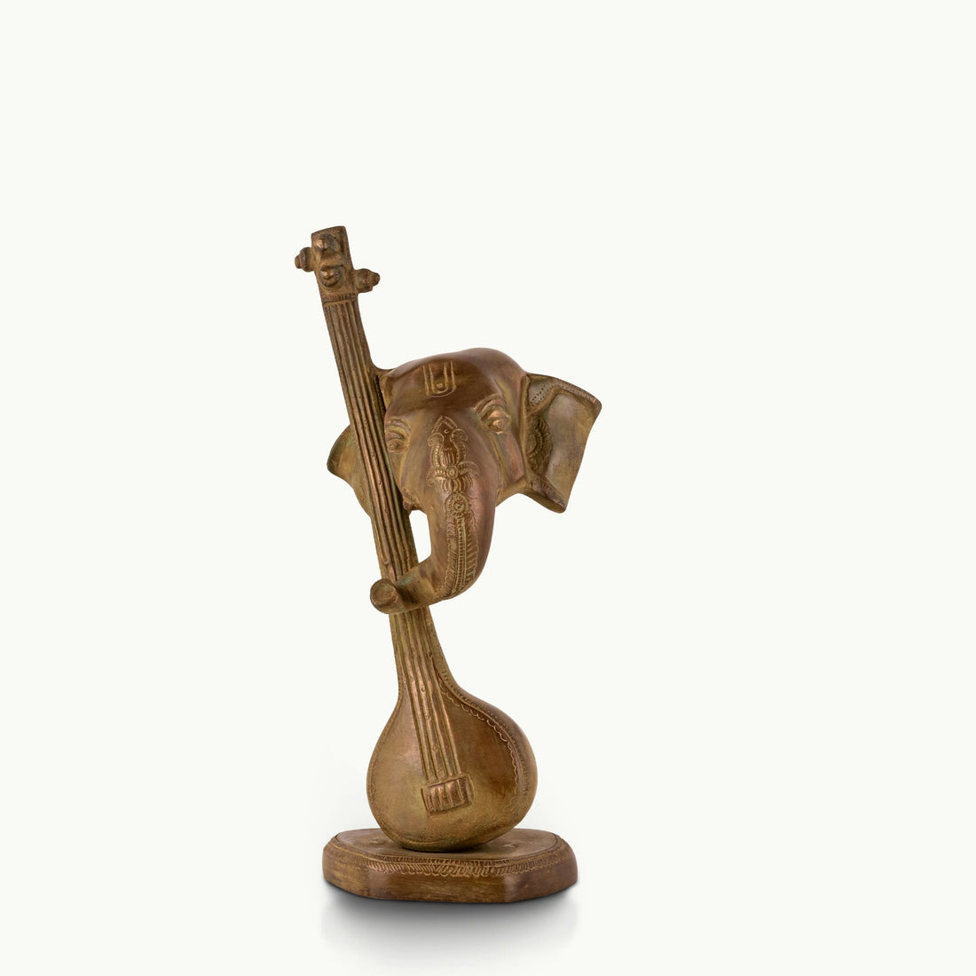 Antique Brass Musical Elephant merging with a veena for a dark walnut desk.