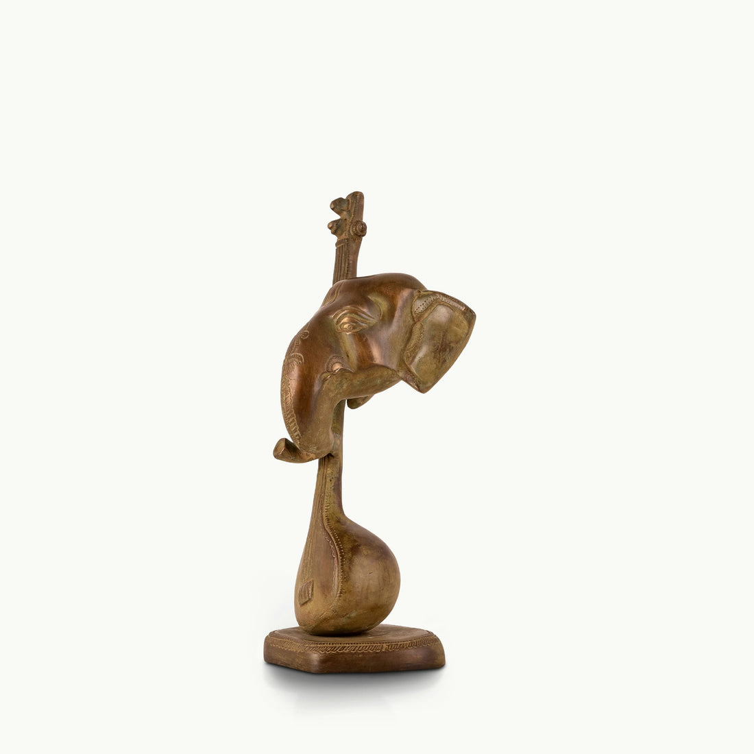 Antique Brass Musical Elephant merging with a veena for a dark walnut desk.