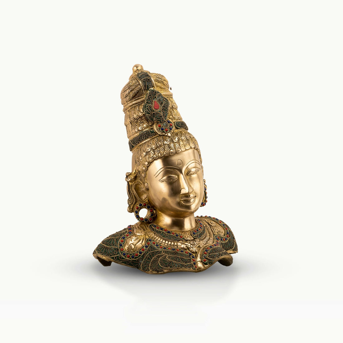 Stone Inlay Brass Goddess Sculpture functioning as a regal centerpiece on an entryway console. 