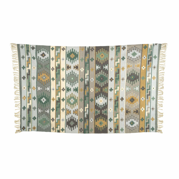 Geometric striped cotton wool kilim in a home office, displaying slate blue and sage green vertical stripes. 