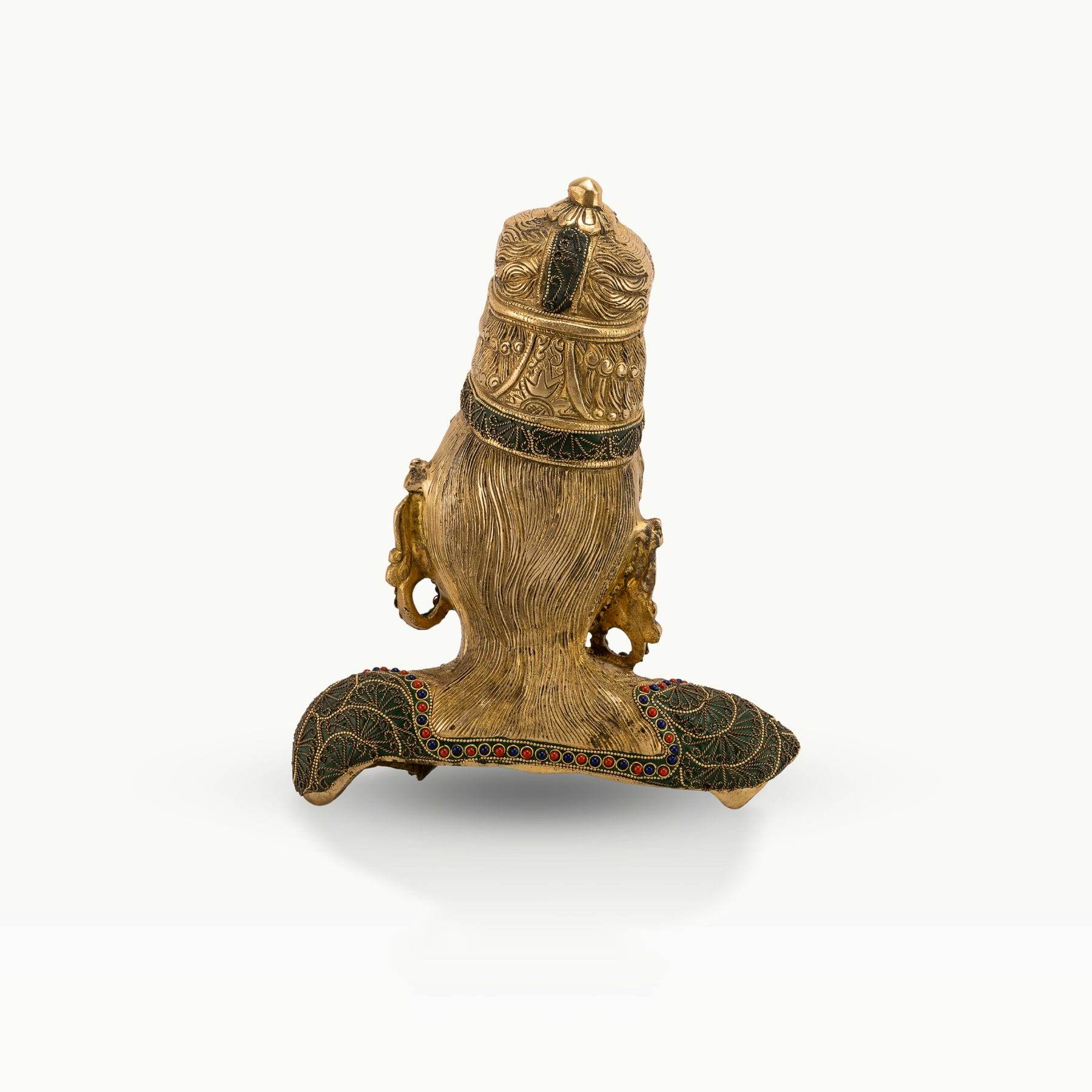 Stone Inlay Brass Goddess Sculpture functioning as a regal centerpiece on an entryway console. 