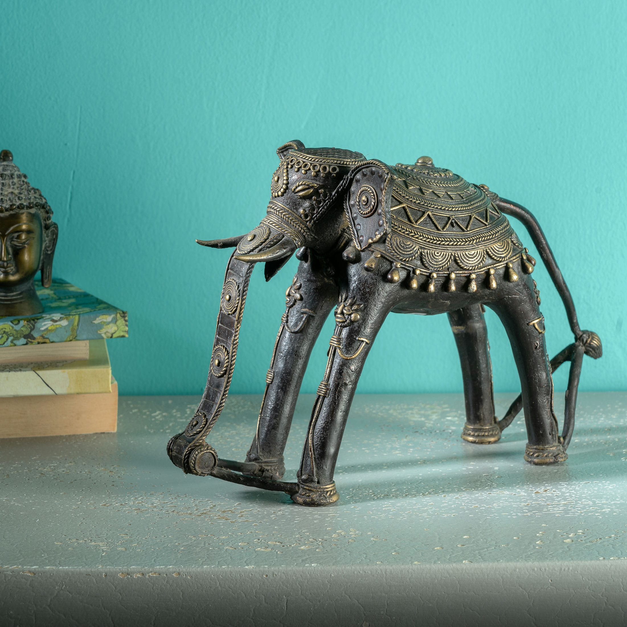 Contemporary Indian metal animal figurine with a sweeping curled trunk 