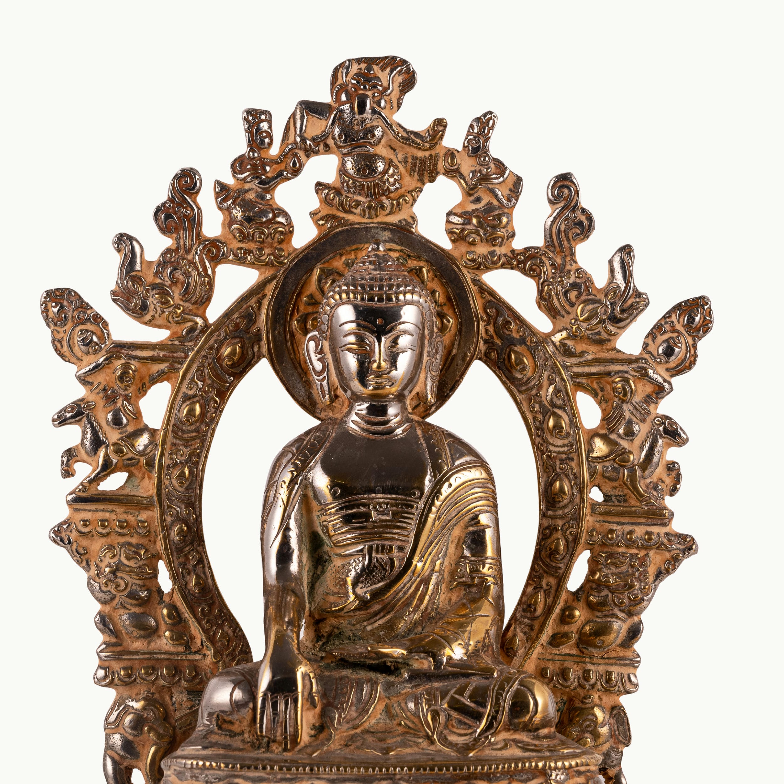 Handcrafted metal enlightened ascetic idol with an antiqued aureole for a meditation room centerpiece or spiritual housewarming gift.