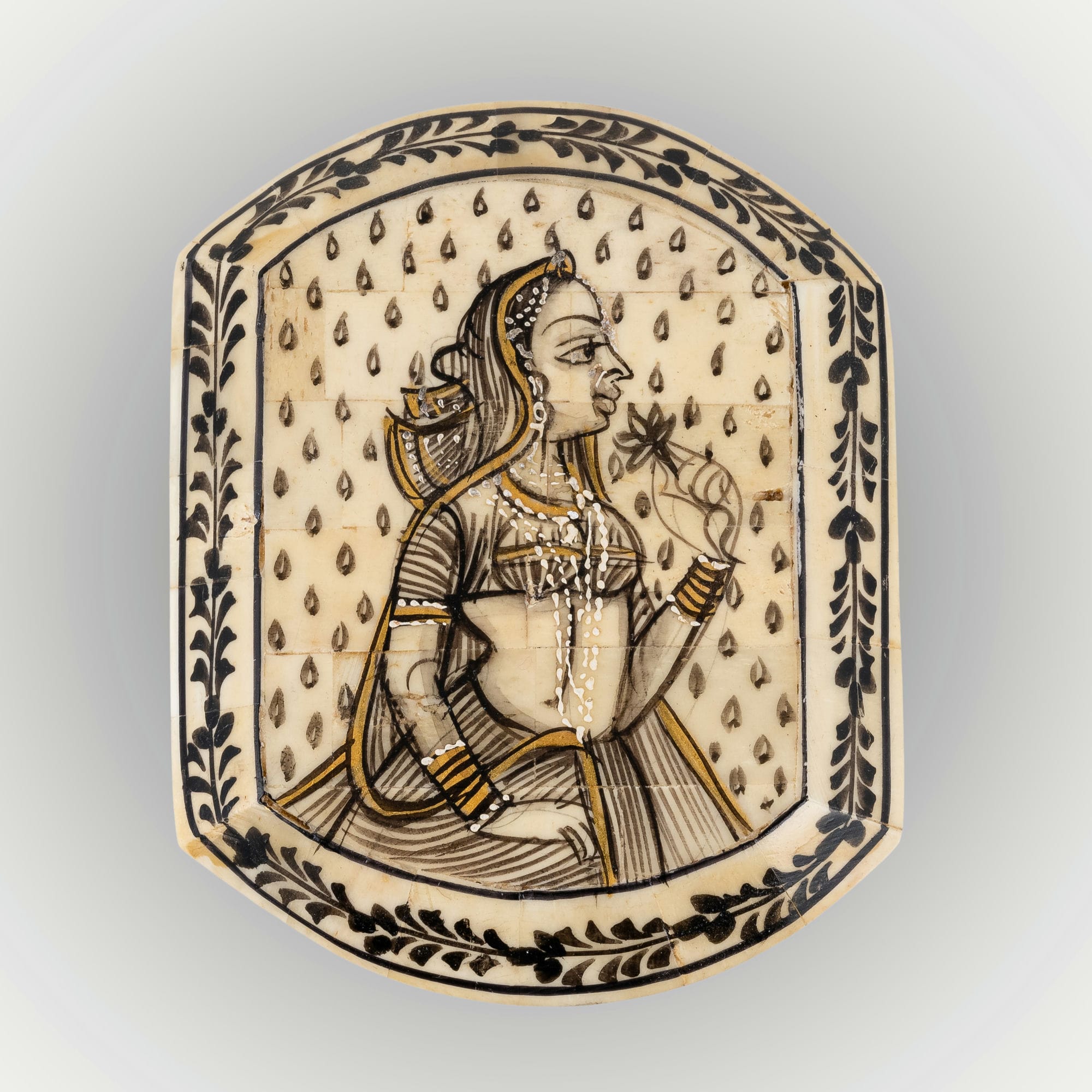 Portrait painted camel bone box featuring a Rajput noblewoman and black floral borders.
