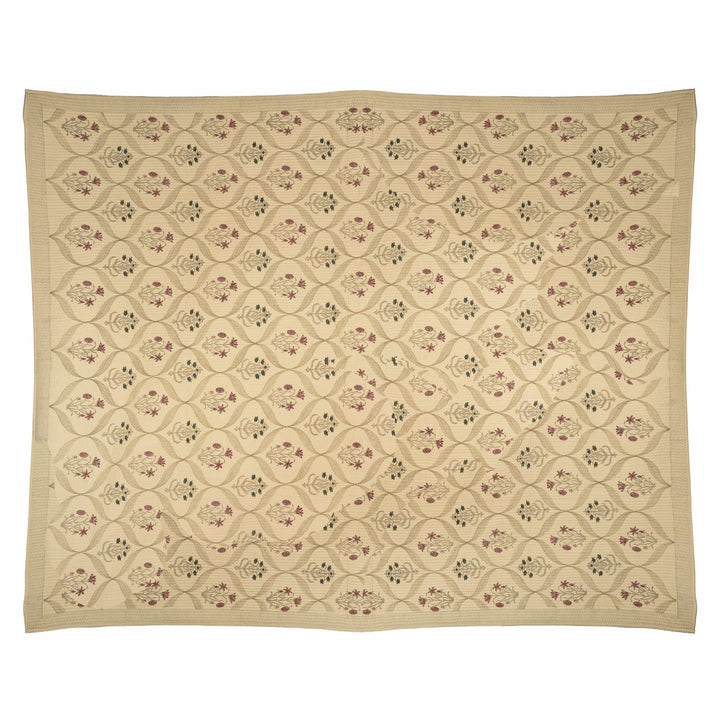 Trellis block-print cotton bedcover featuring rose pink and teal floral motifs within a sweeping vine border.